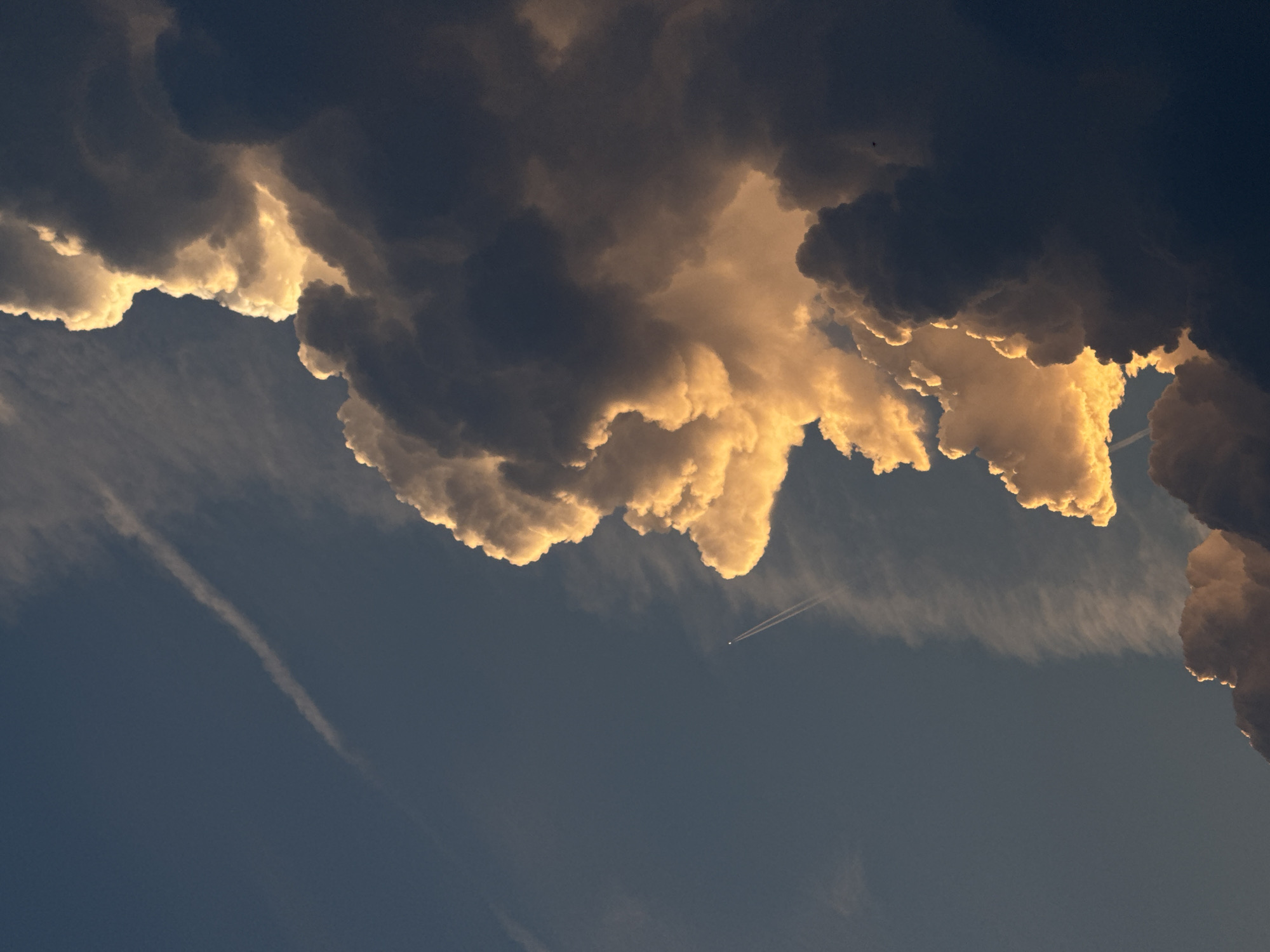 Storm clouds and golden light over Putten at sunset