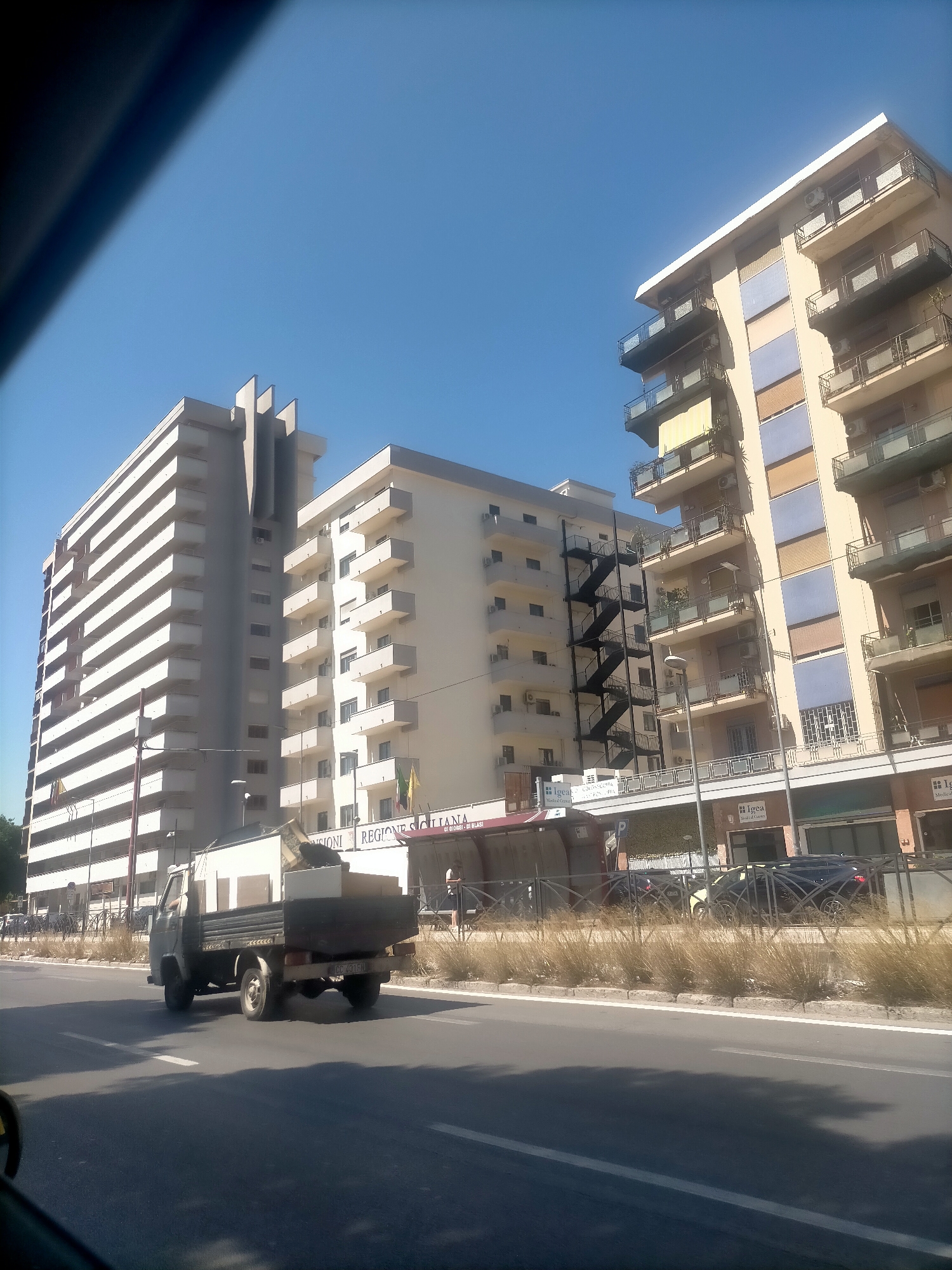 Furniture-laden truck rolling through Palermo streets