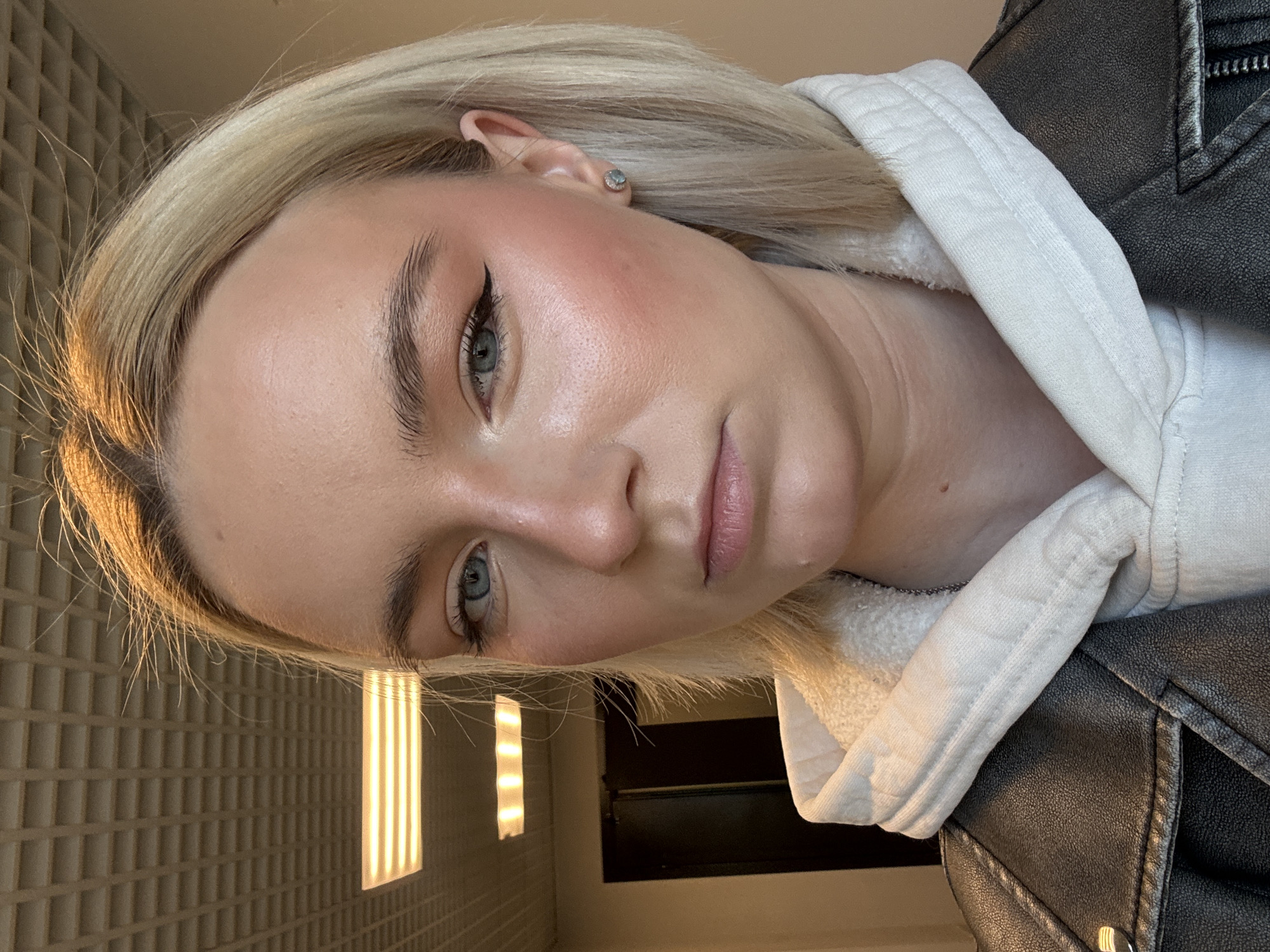 Blonde woman photographed near Russian apartment buildings early morning