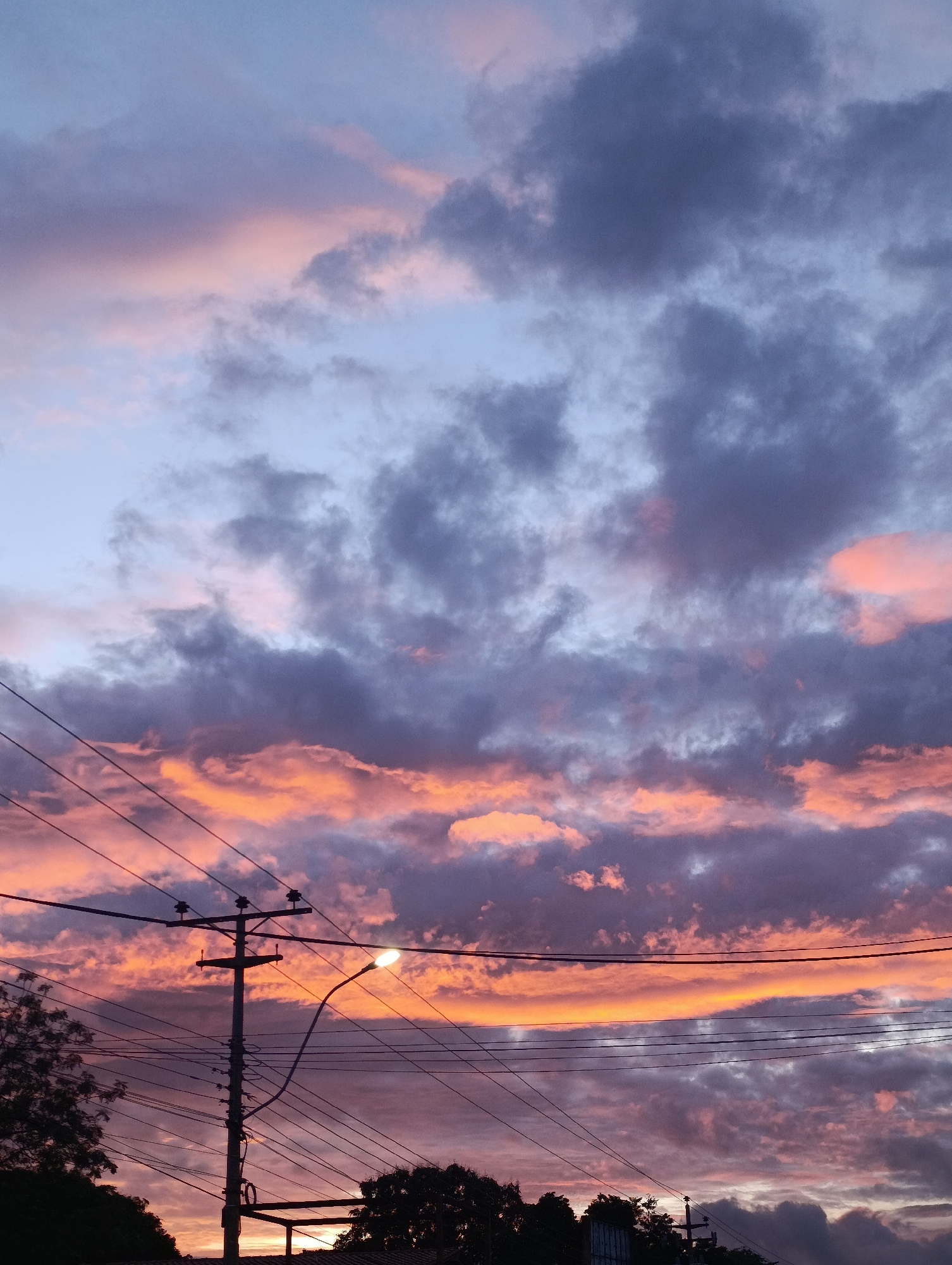 Dramatic sunset colors captured over Juan Griego Venezuela streets