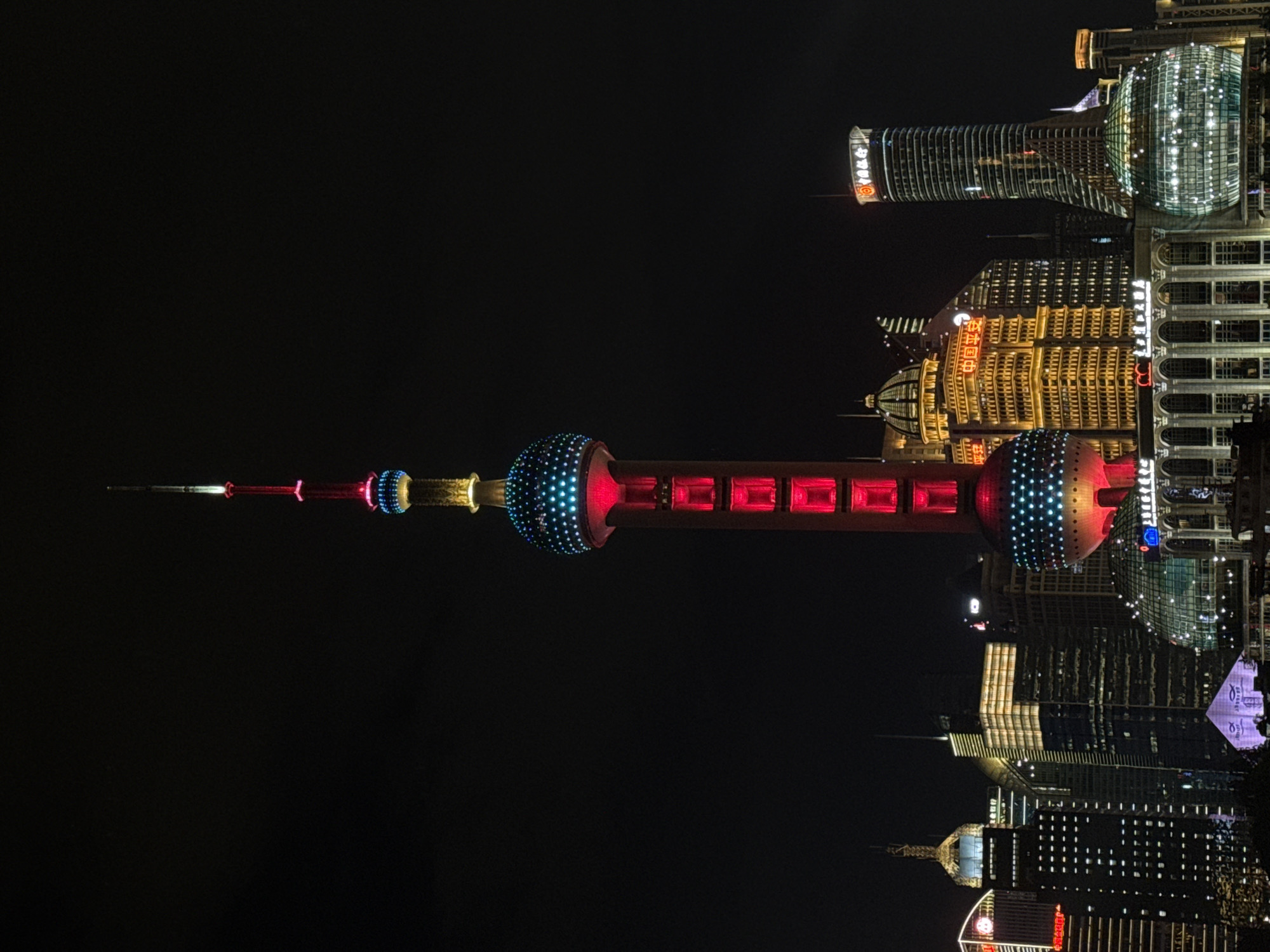 Shanghai's Pudong skyline glowing at night from the Bund