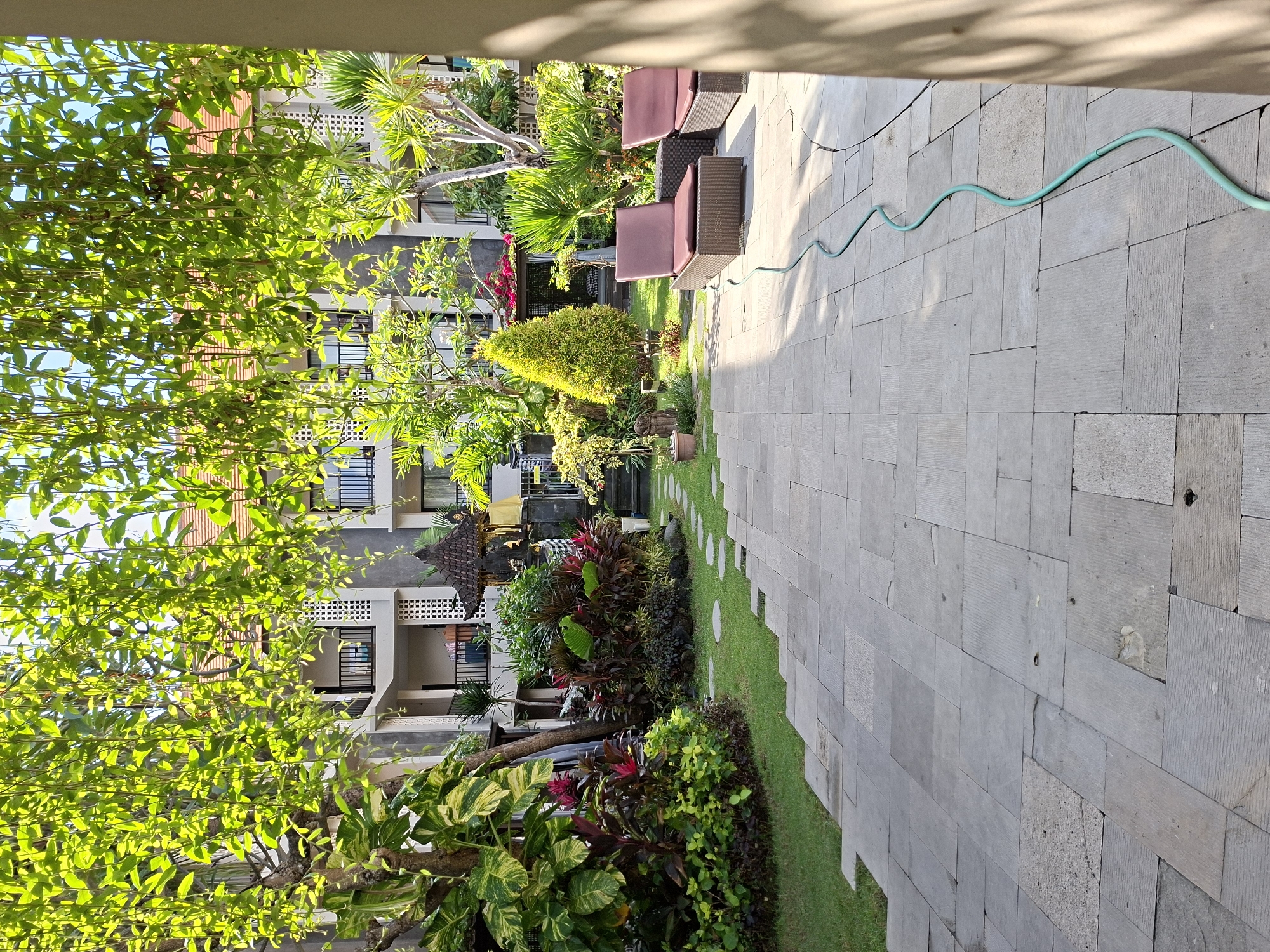 Kuta resort grounds: pool, courtyard, and walkways
