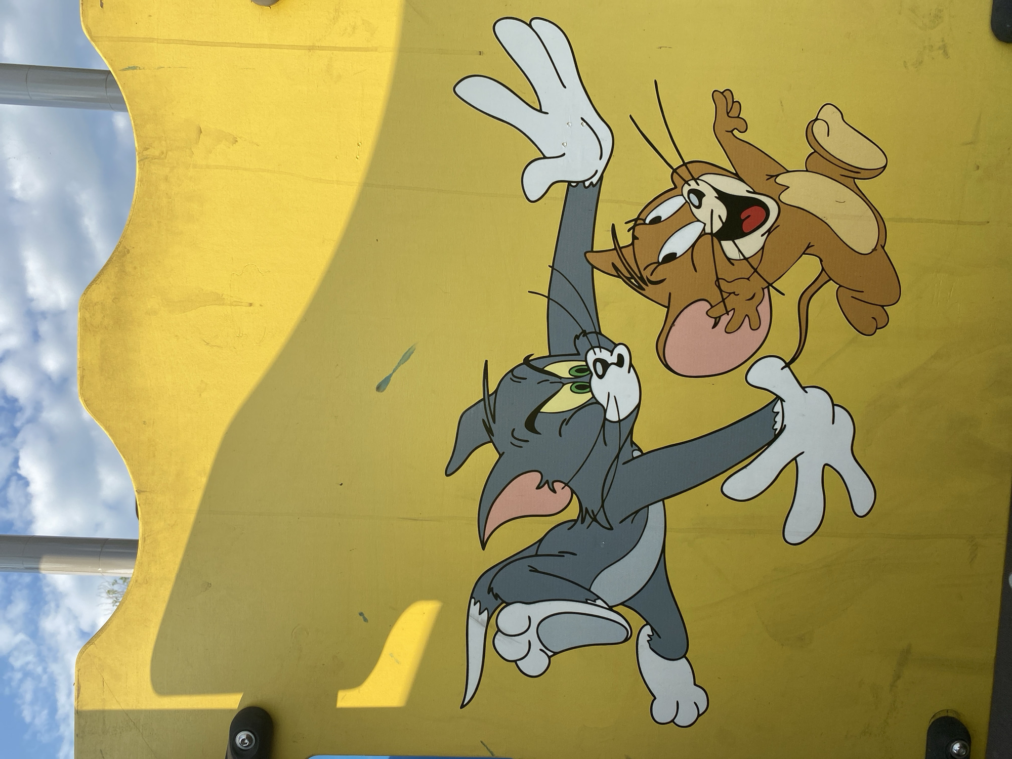 Tom & Jerry murals and a domed church under renovation in Petropavl