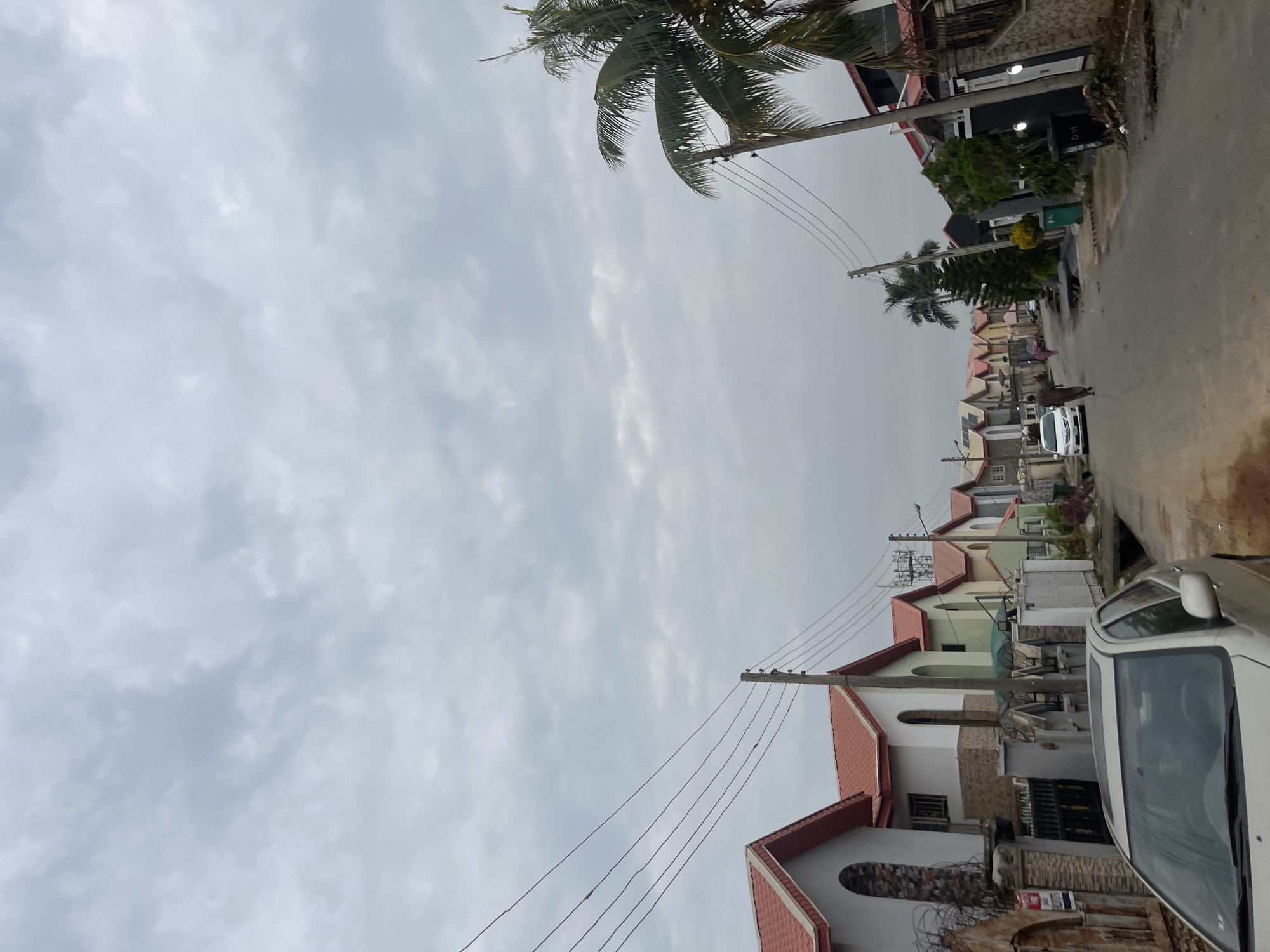 Everyday street life across a residential Abuja neighborhood