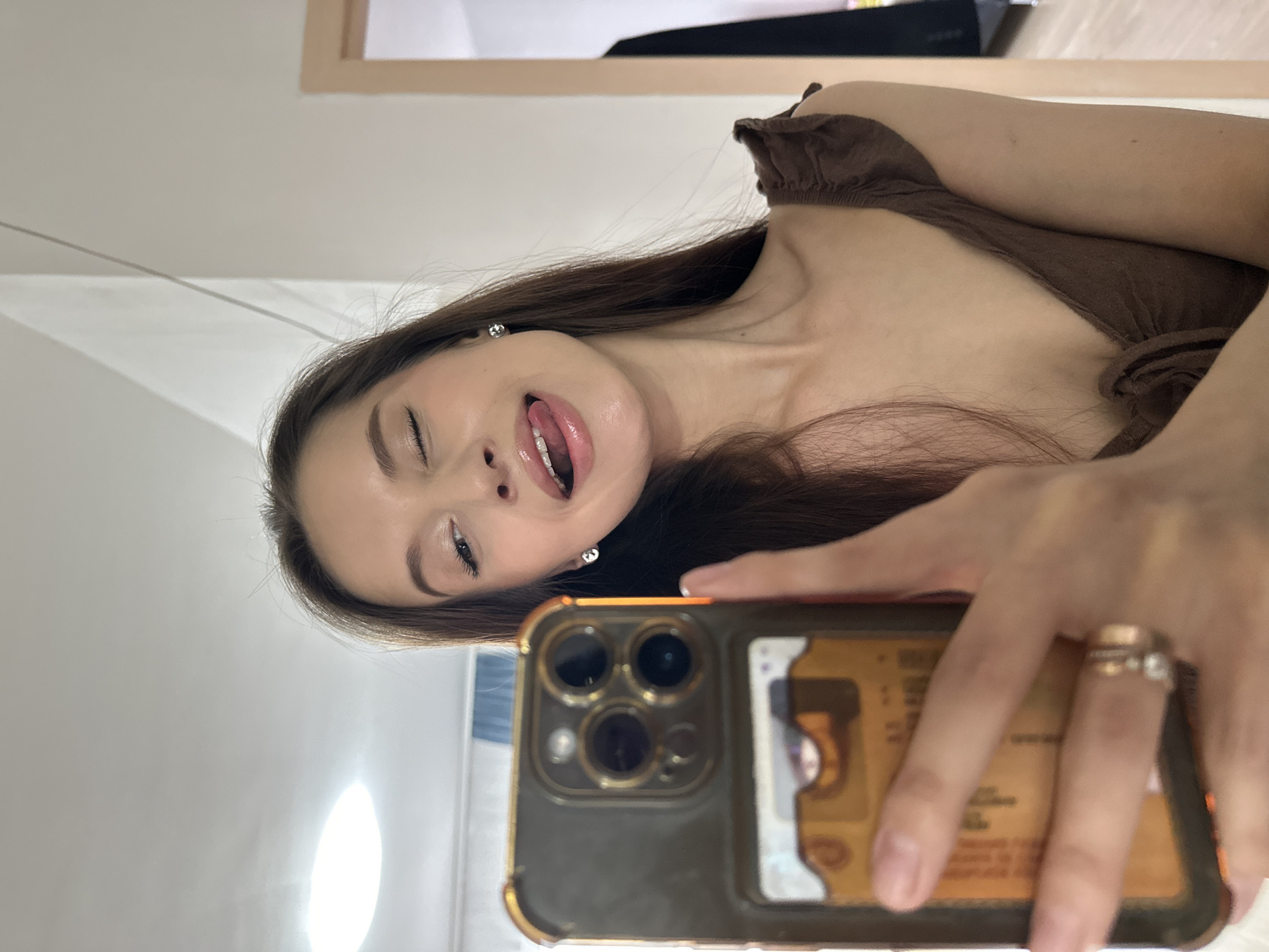 Woman takes playful selfies in Yekaterinburg room
