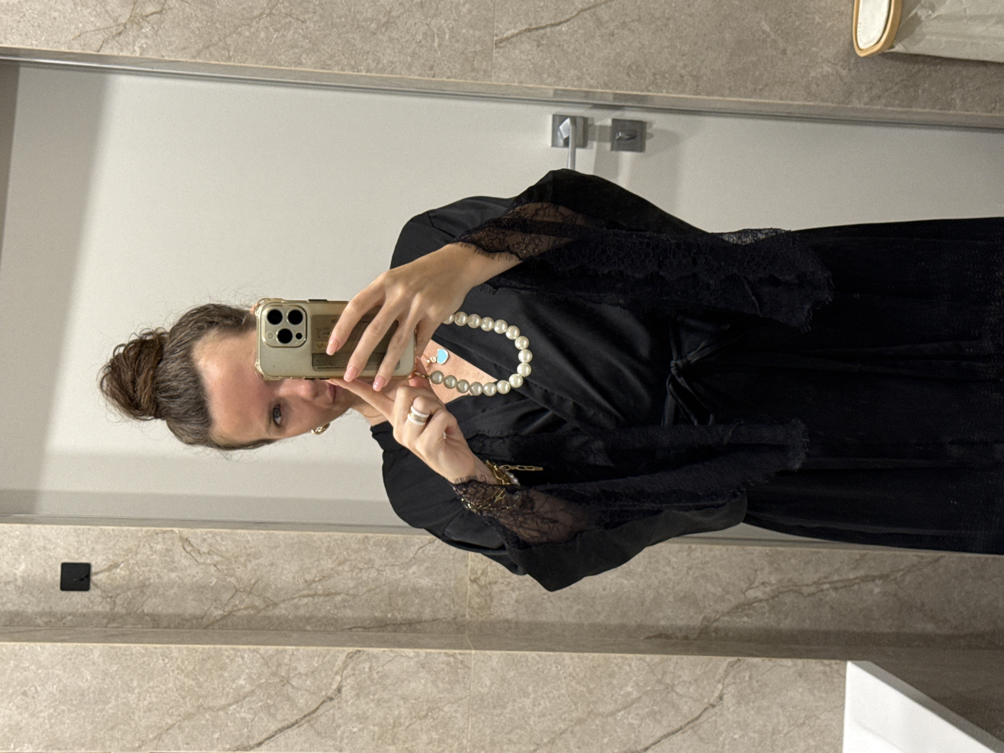 Bathroom mirror selfie in black robe and pearl necklace
