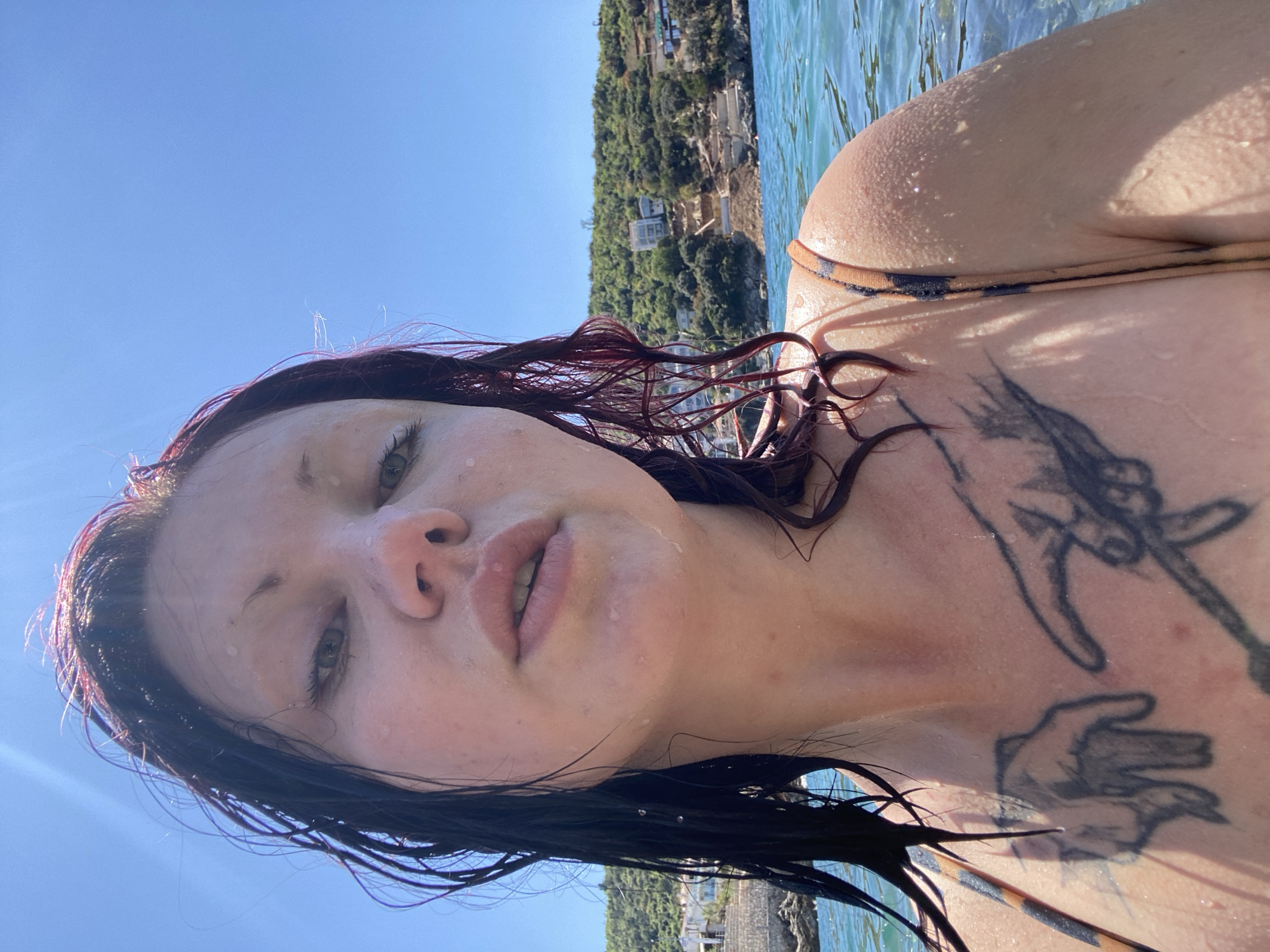 Woman enjoys sunny swim session at Montenegro waterfront