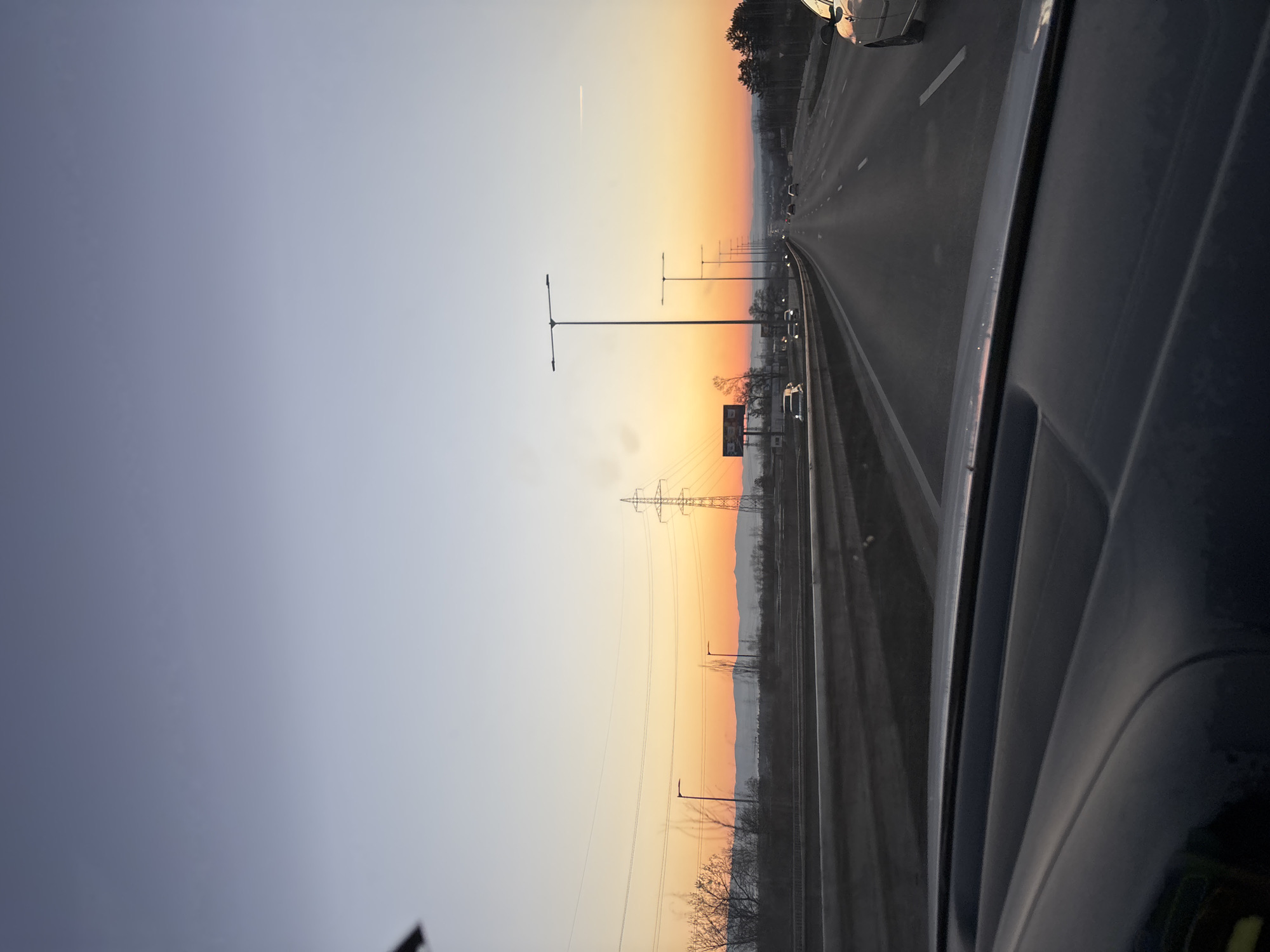 Highway traffic observed near Sofia with directional signage at dusk