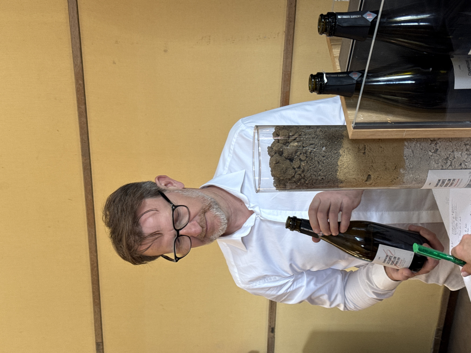Man conducts champagne tasting presentation in Reims, France