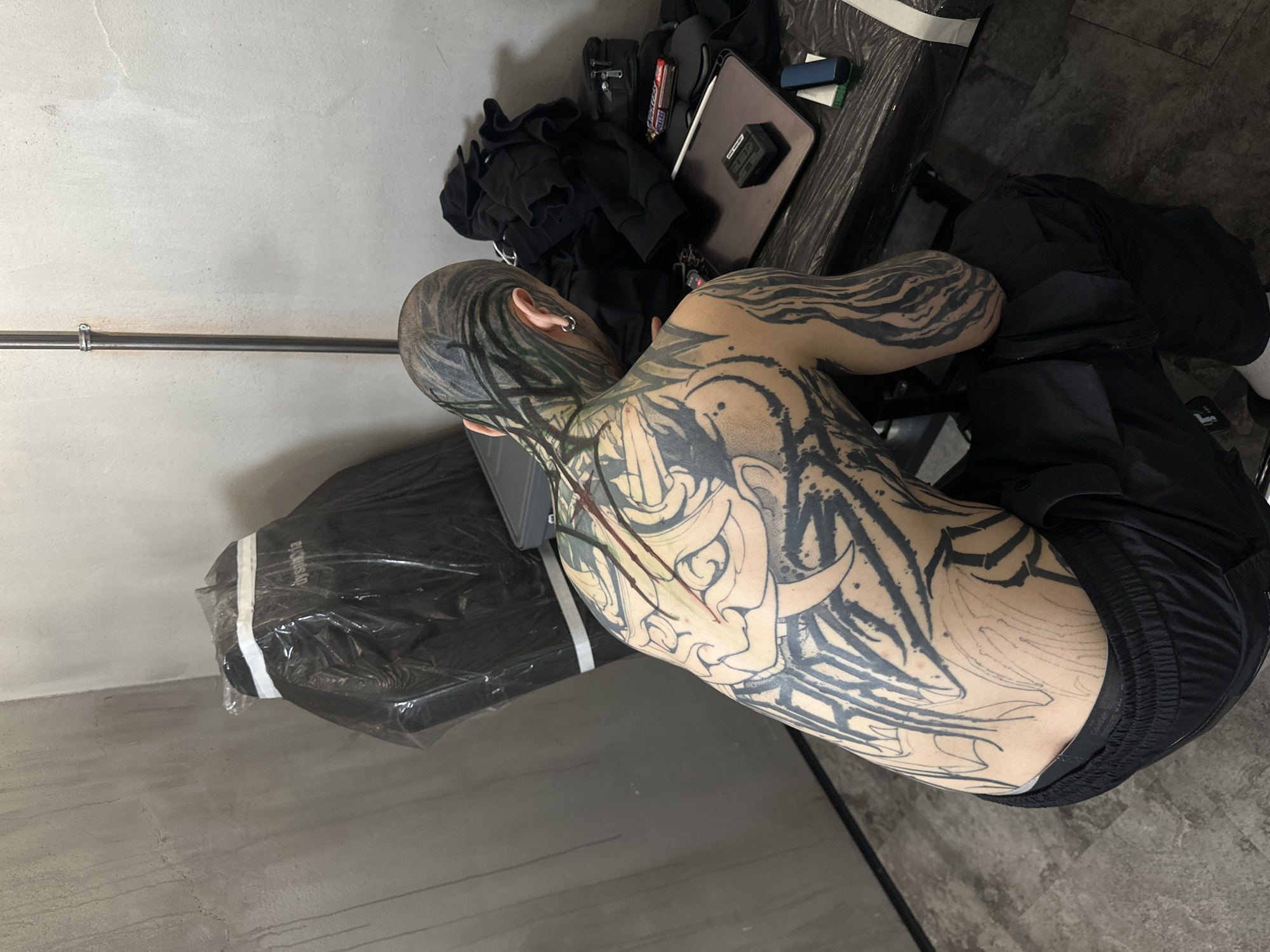 Extensive tattoo session documented at Moscow studio