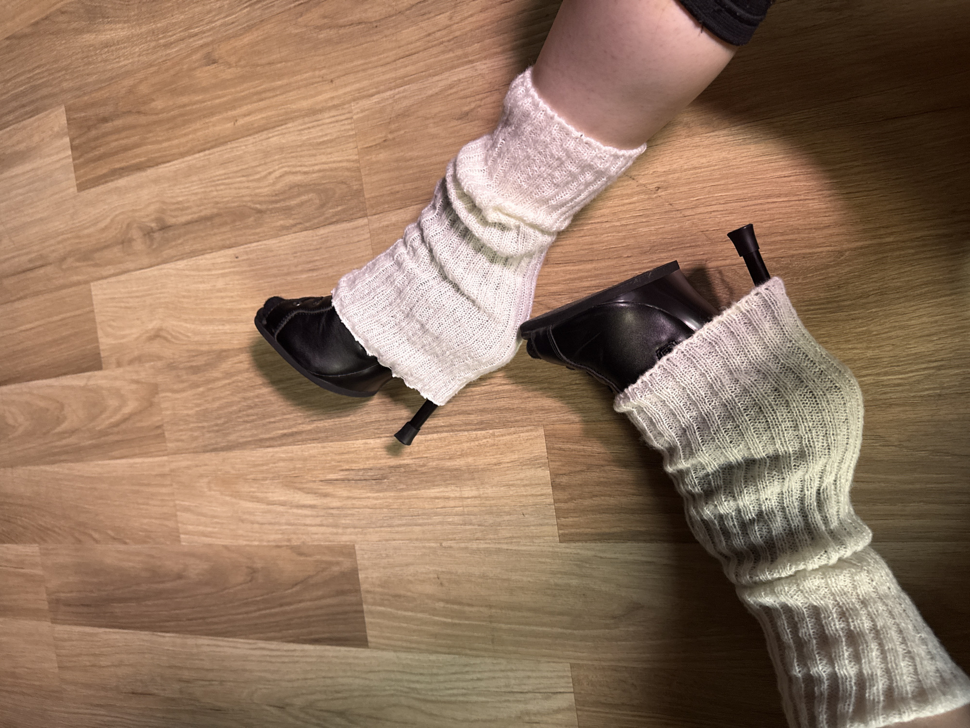 Indoor gathering documented in Sofia featuring distinctive fashion choices