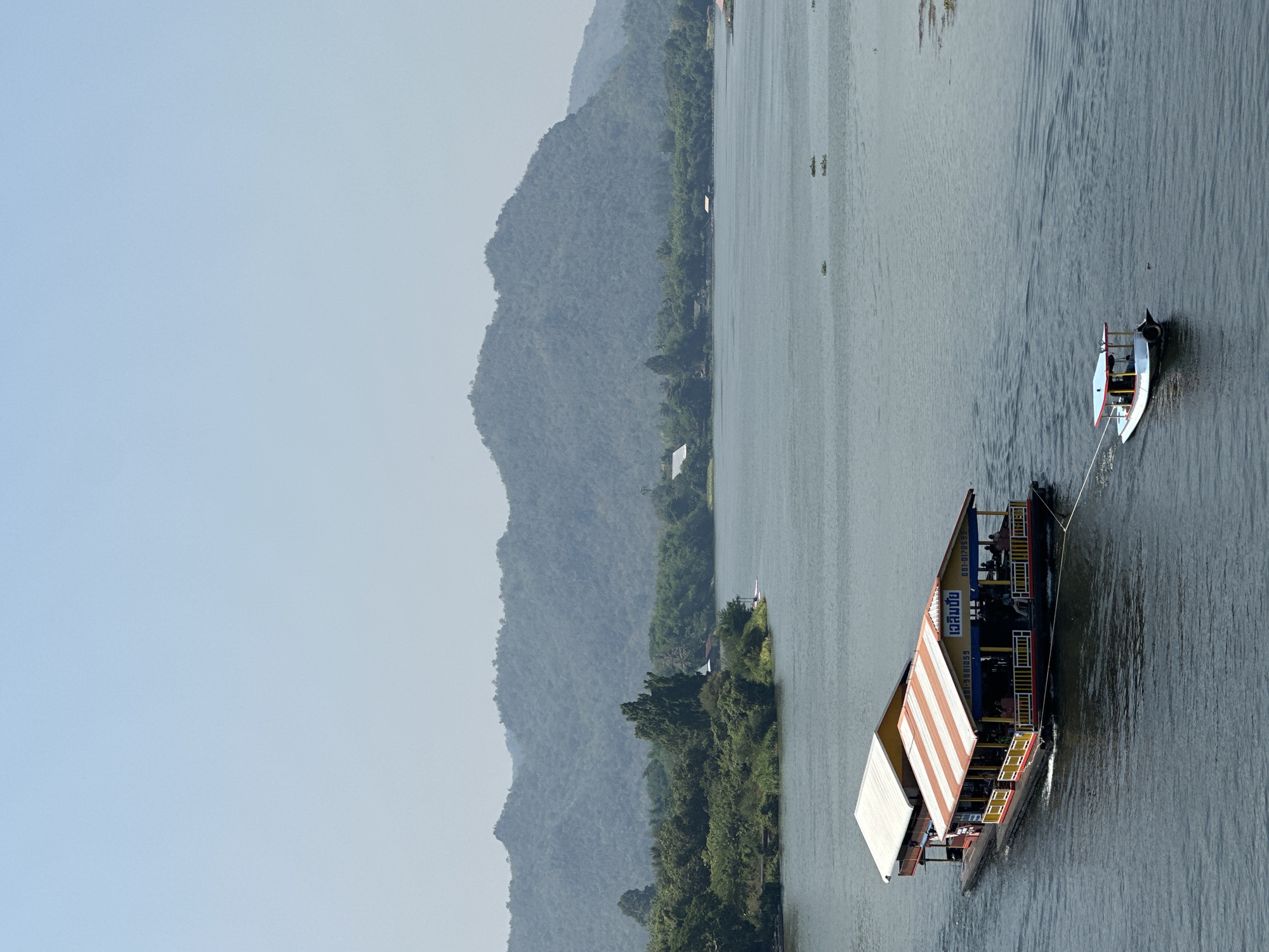 Tourists visit glass skywalk over River Kwai in Thailand