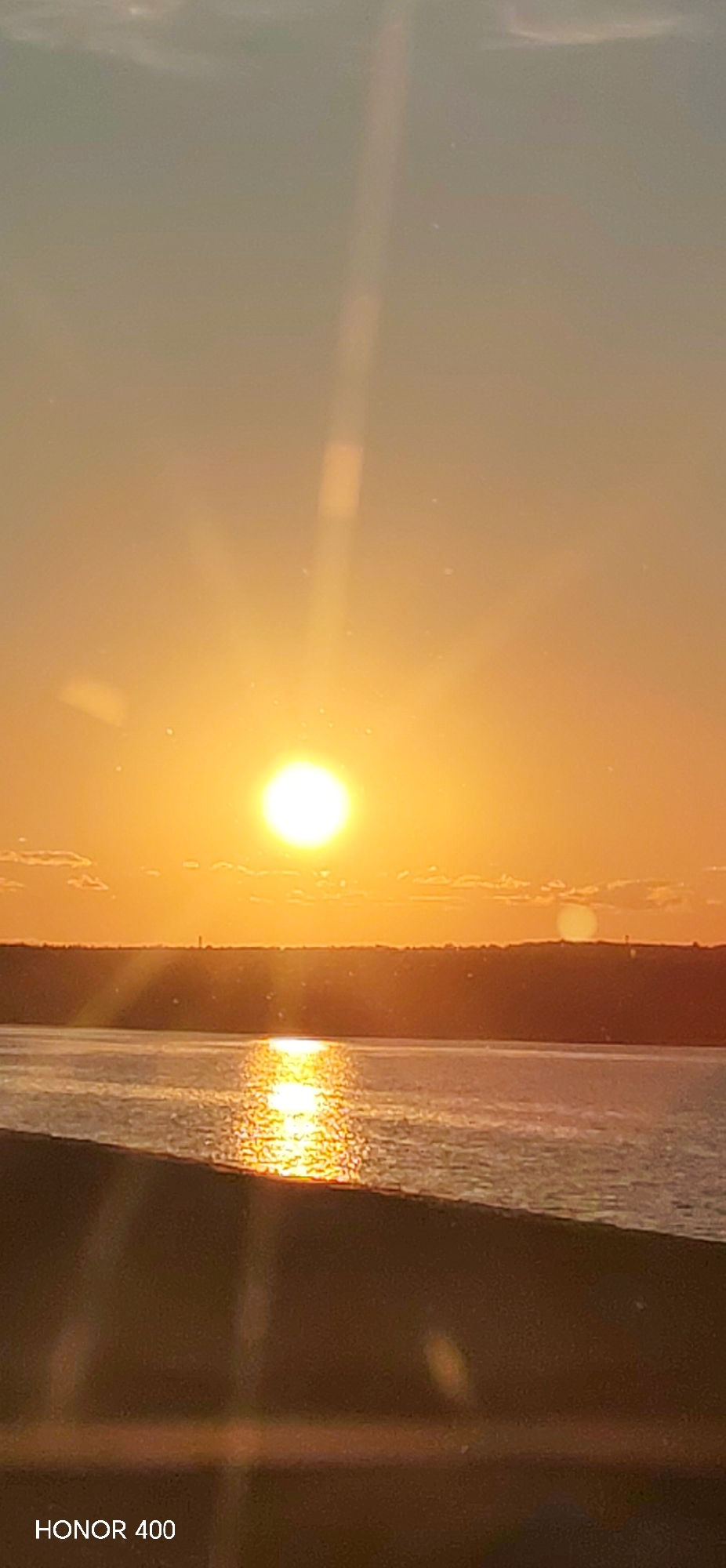 Sunset documented over water in Chaikovsky, Russia