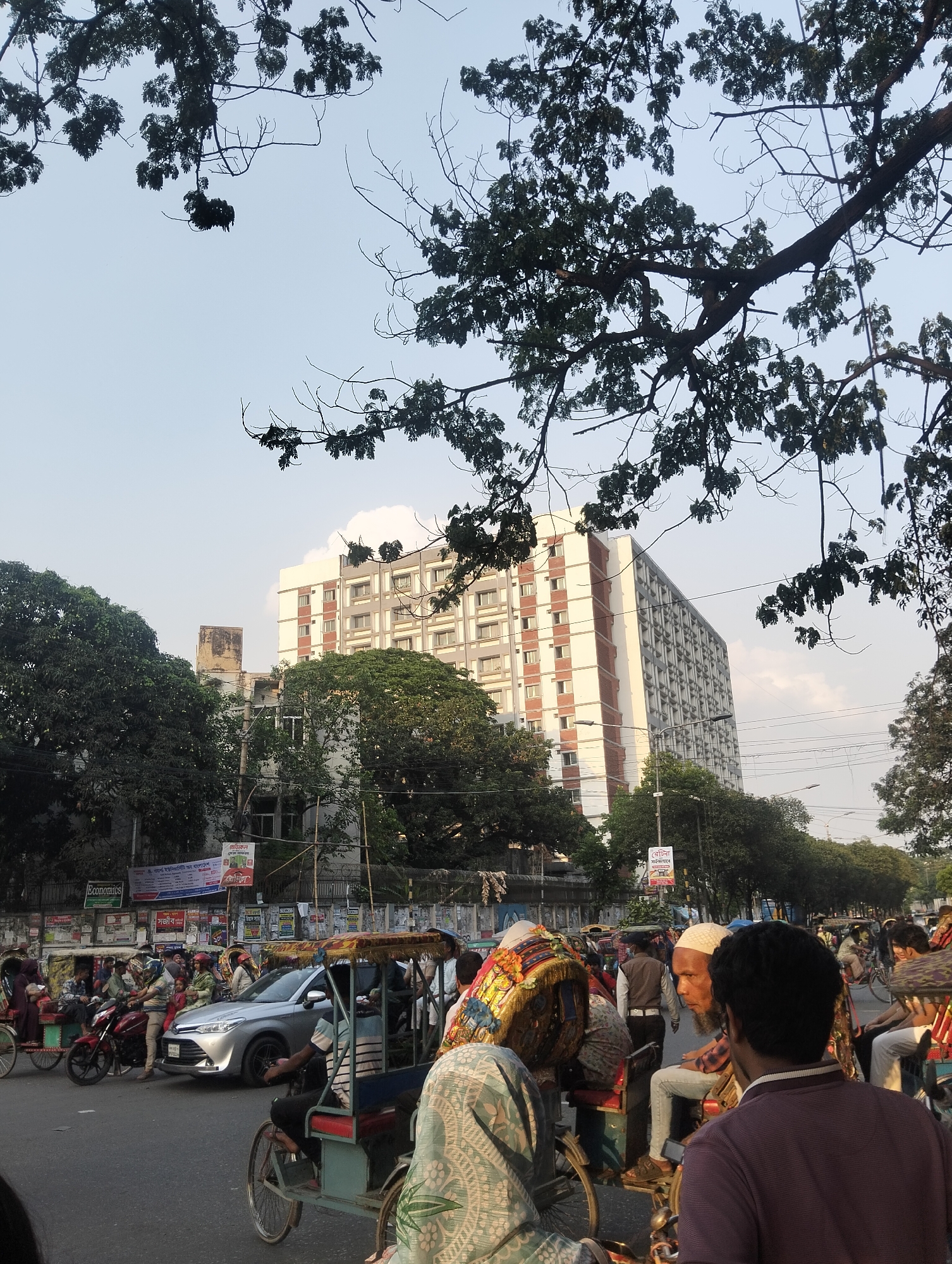 Daily street life documented across Dhaka neighborhoods Friday morning