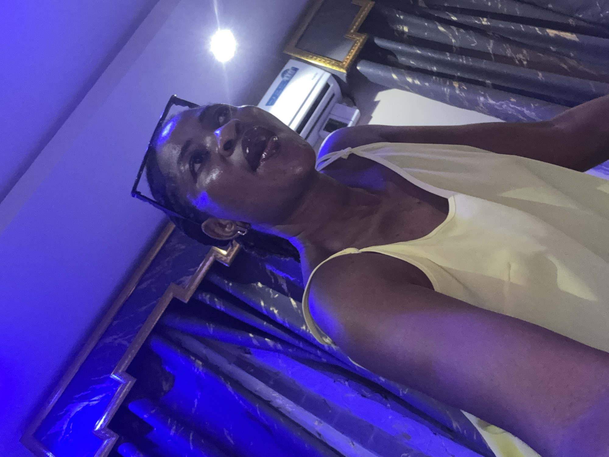 Yellow fits and selfies in a moody Ajara interior