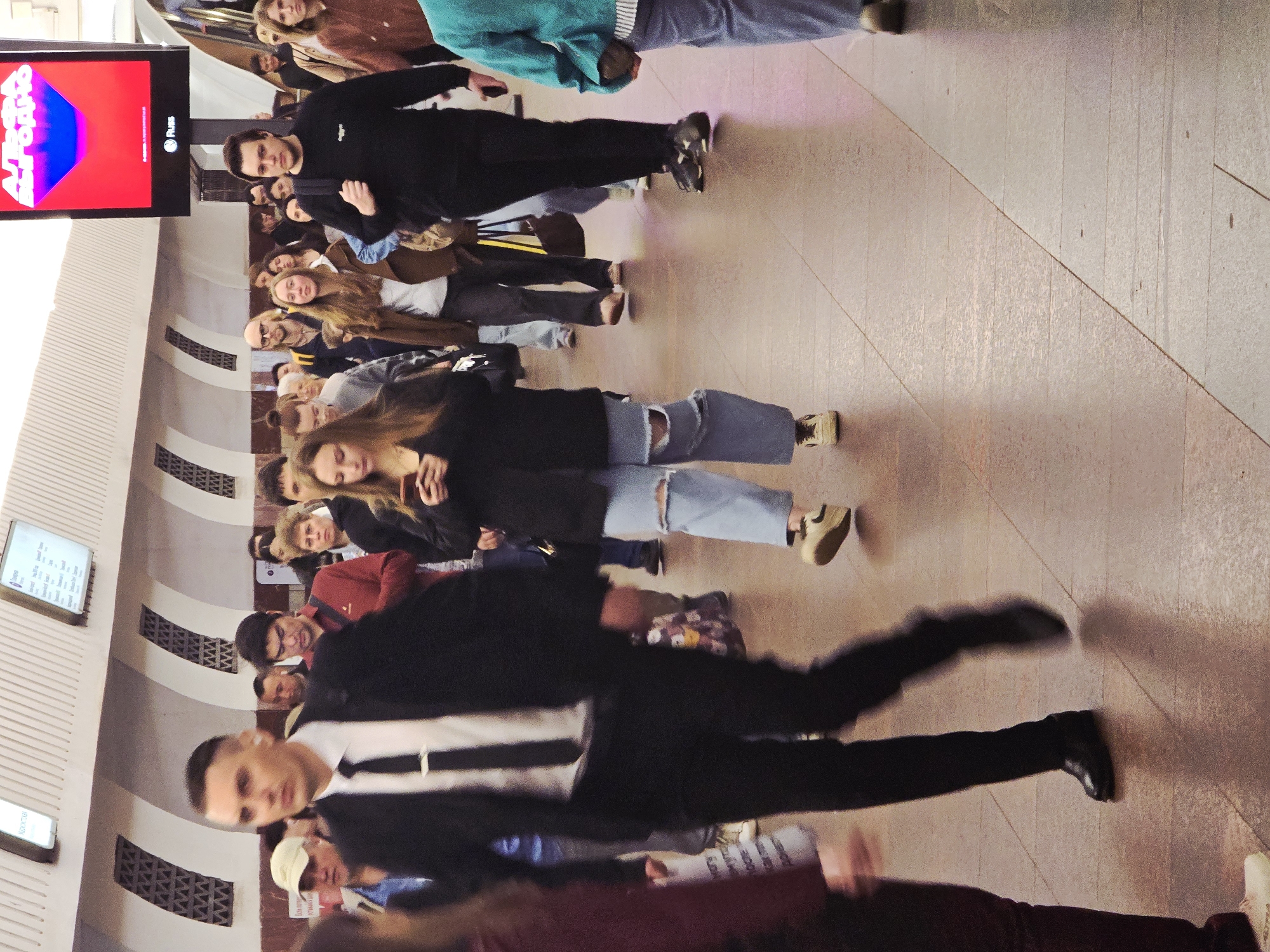 Young adults gather in unidentified underground transit station