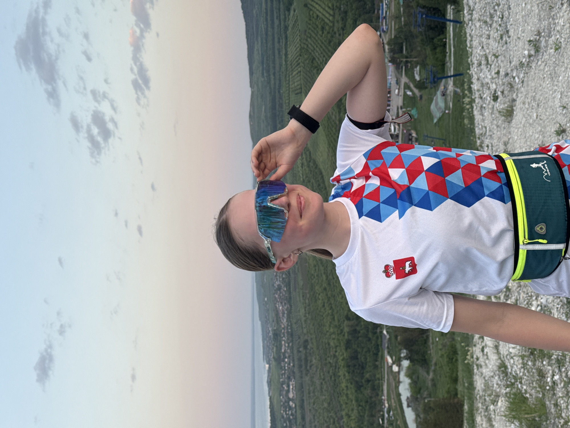 Woman views Khvalynsk landscape from rocky overlook