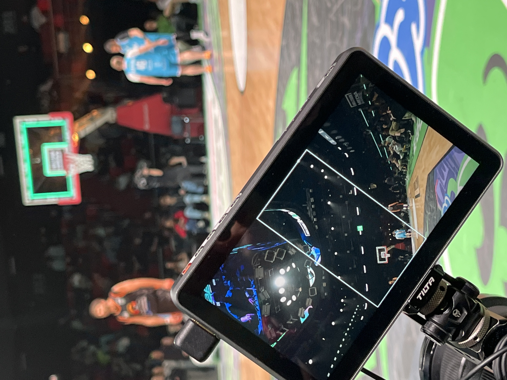 Basketball game viewed through camera monitor in Moscow