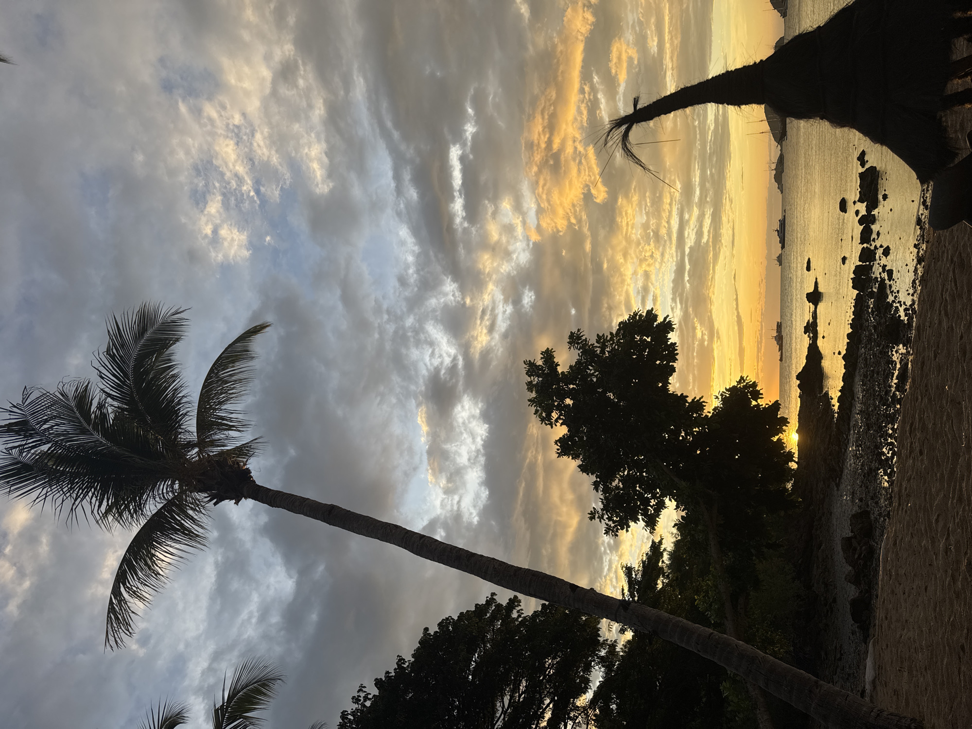 Coastal sunset documented from multiple perspectives at unknown location
