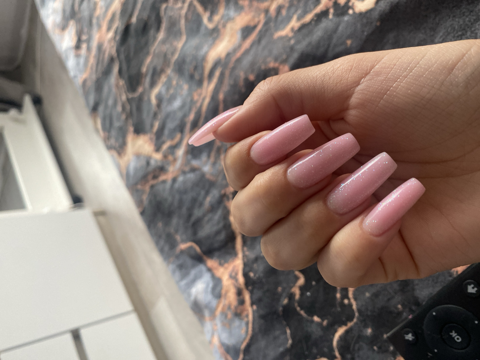 Woman documents nail art in early morning selfie session