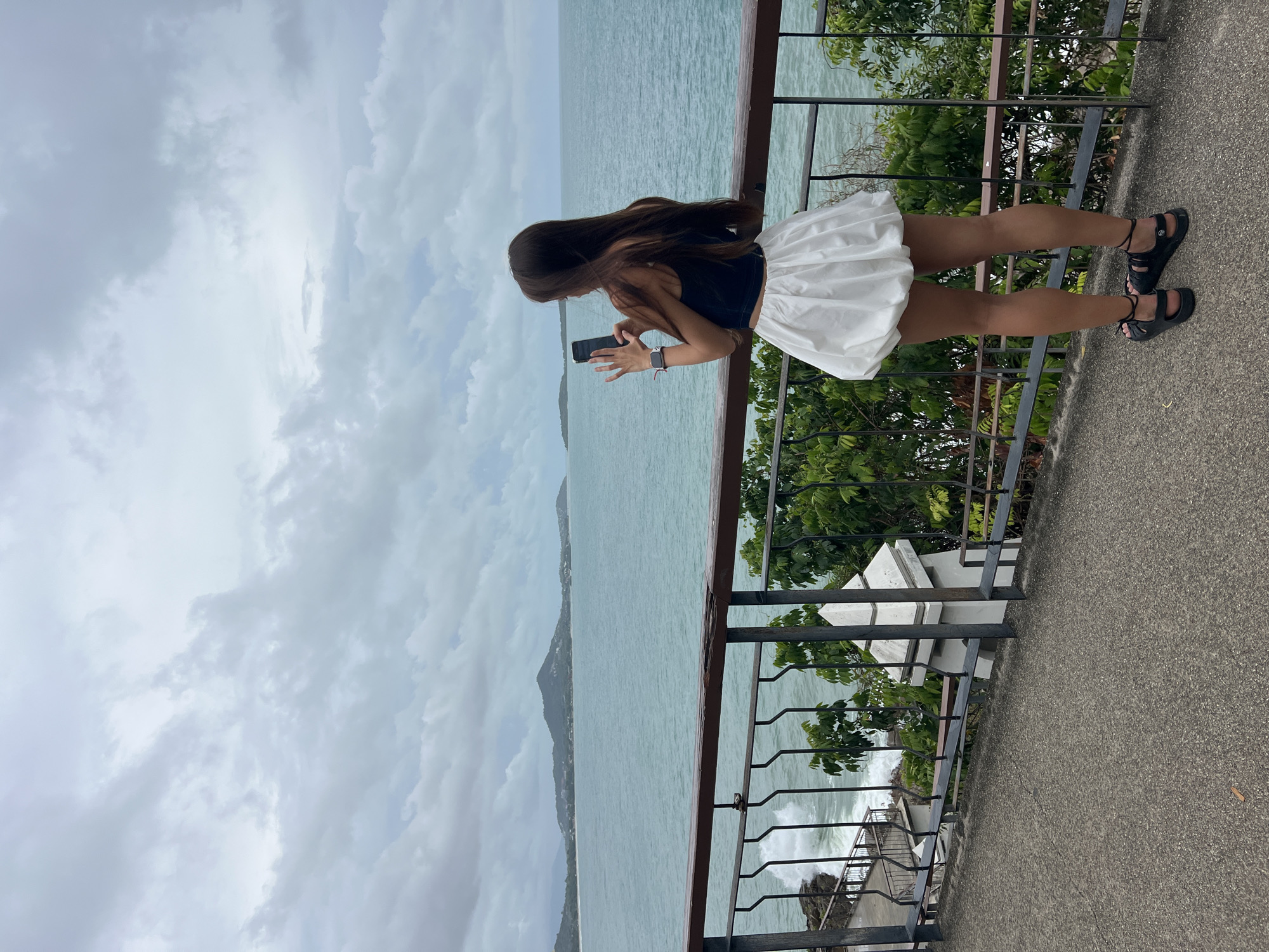 Woman observed on oceanfront patio in Baan Chaweng Noi