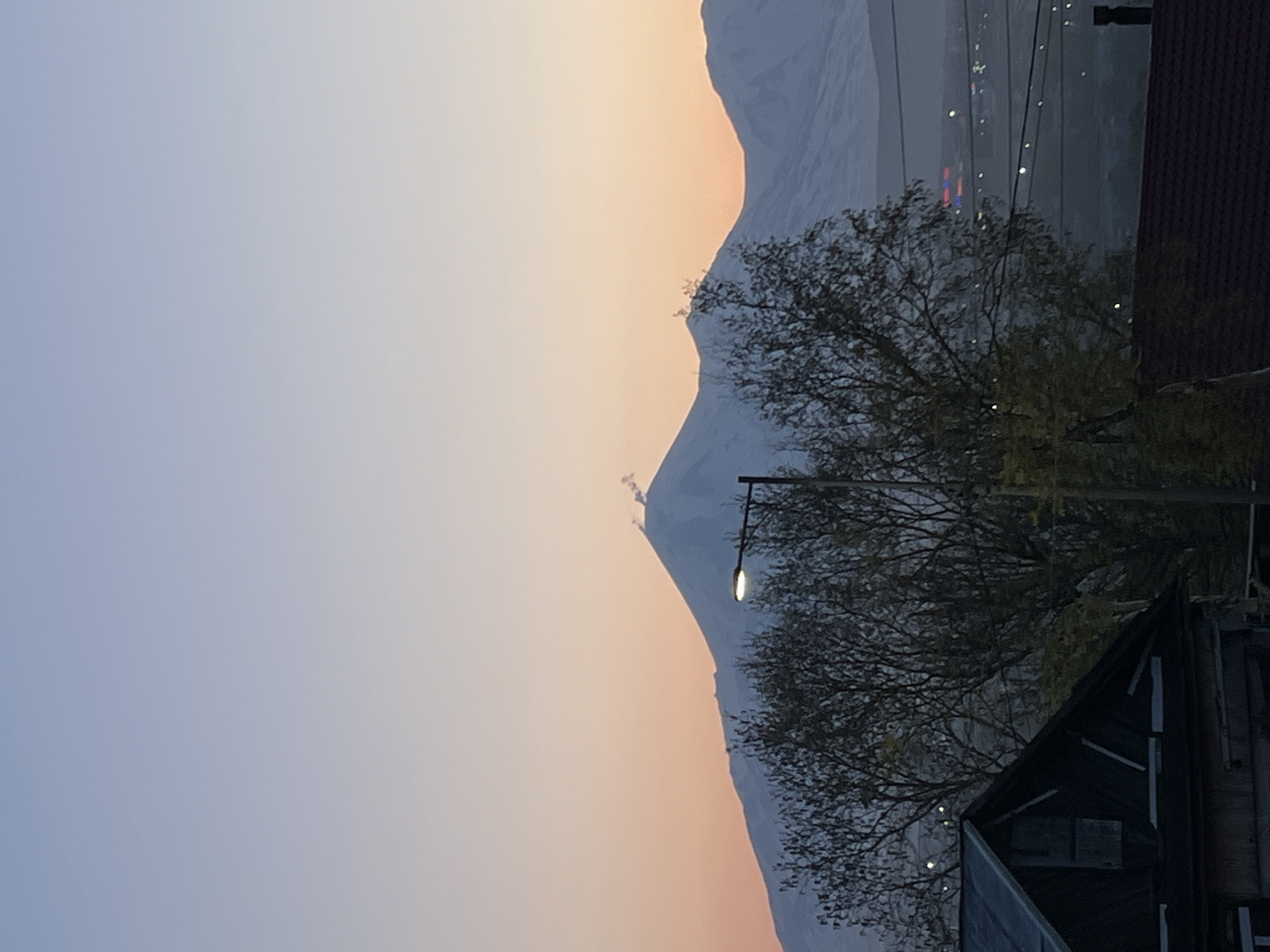 Dawn breaks over fog-covered Petropavlovsk-Kamchatsky amid volcanic peaks