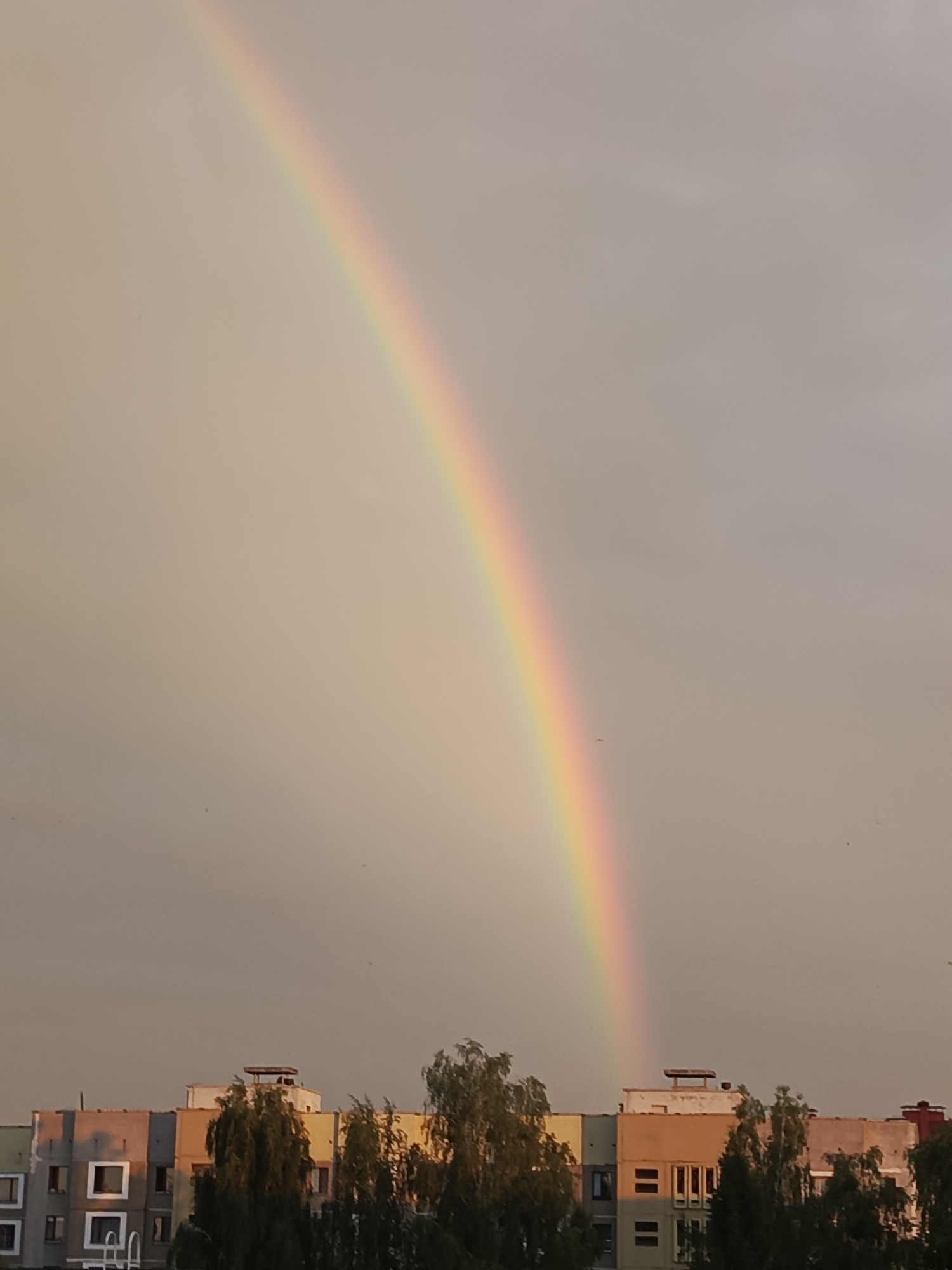 Rainbow over colorful apartment blocks in Biaroza, Belarus