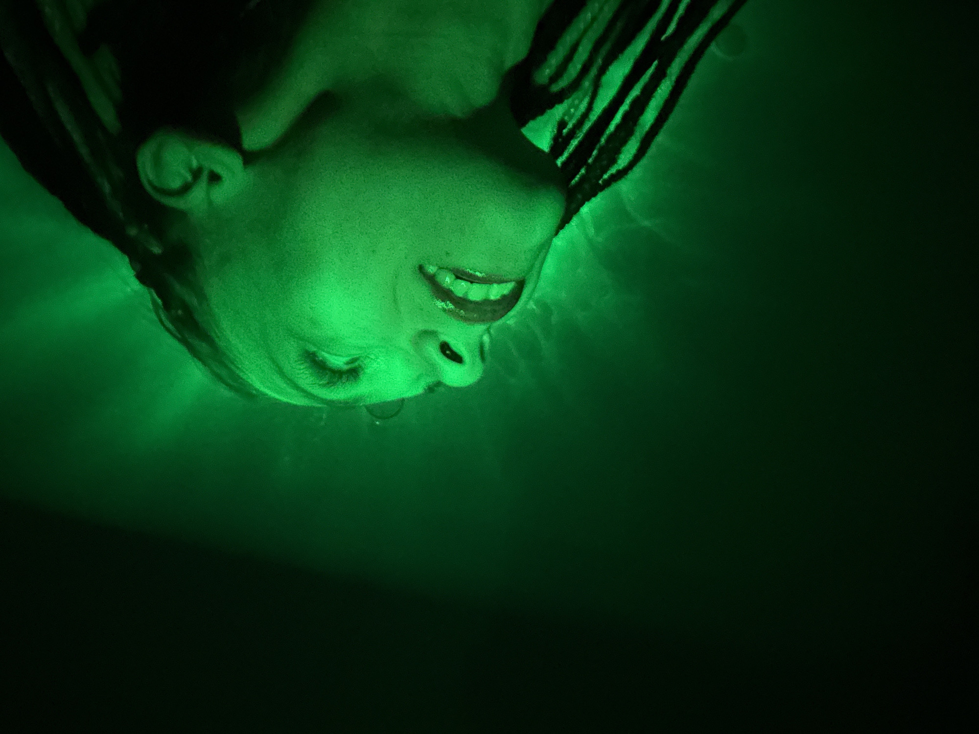 Underwater portrait captured in green light near Rusanovo