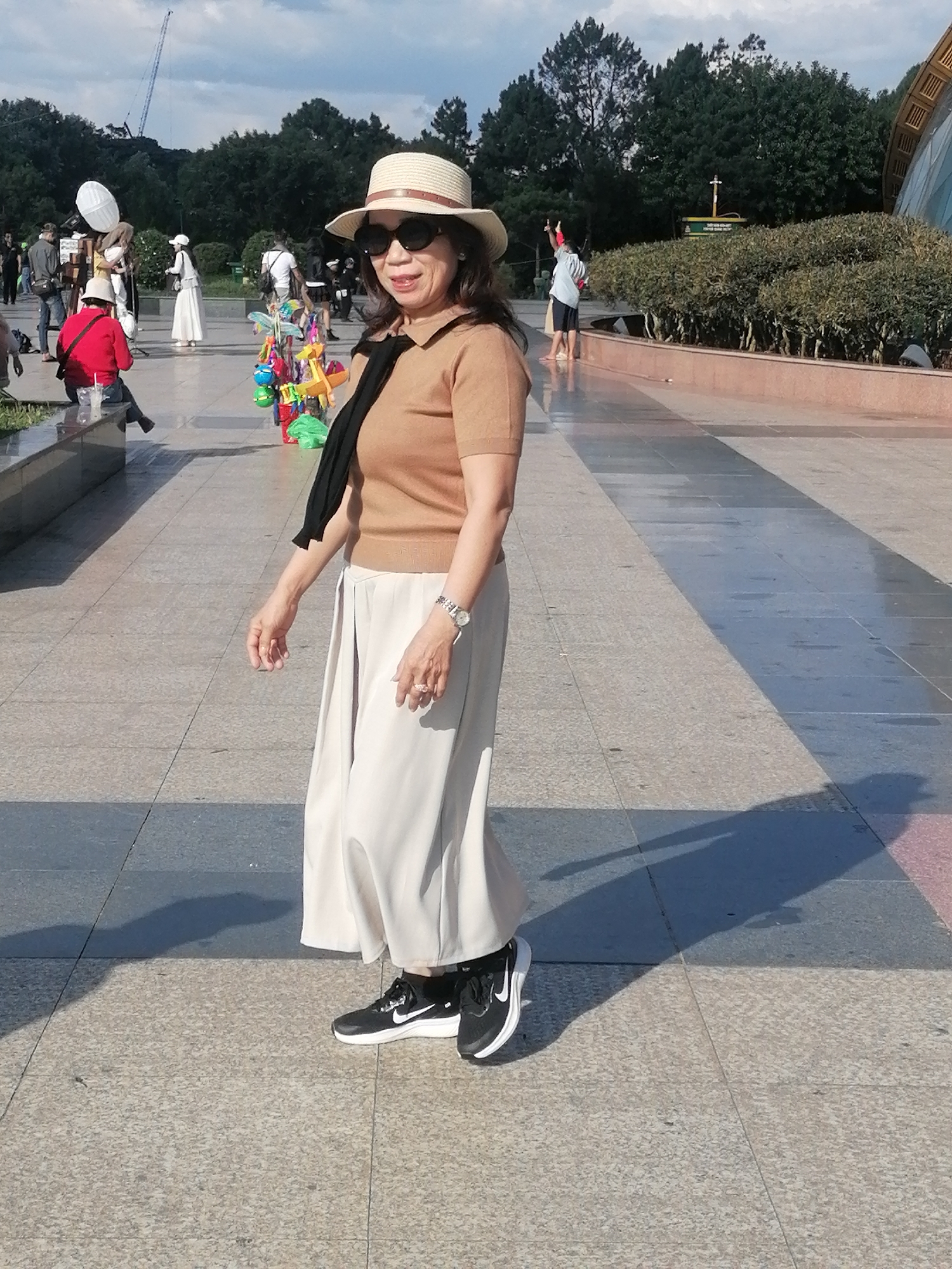 Morning crowd at a modern public walkway in Da Lat