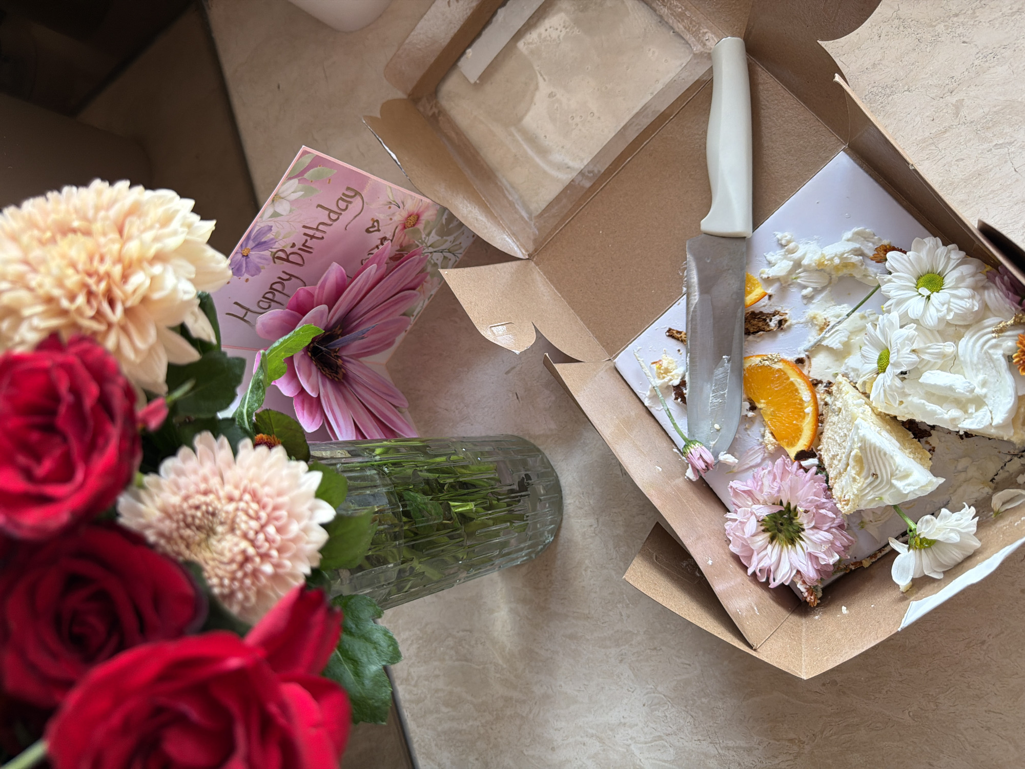Woman documents breakfast with flowers in Mengwi kitchen