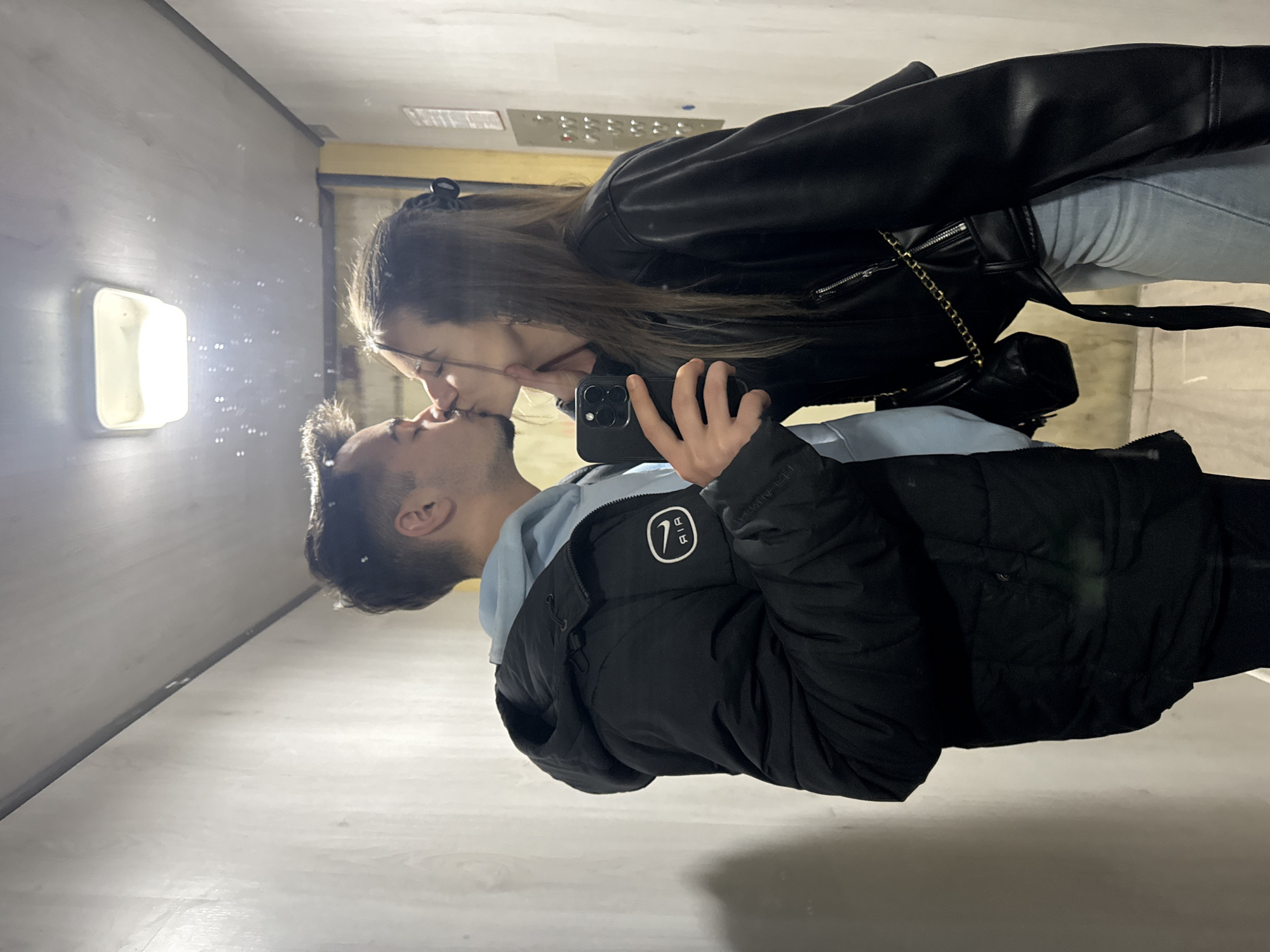 Couple shares intimate elevator moment while taking selfie in Sofia