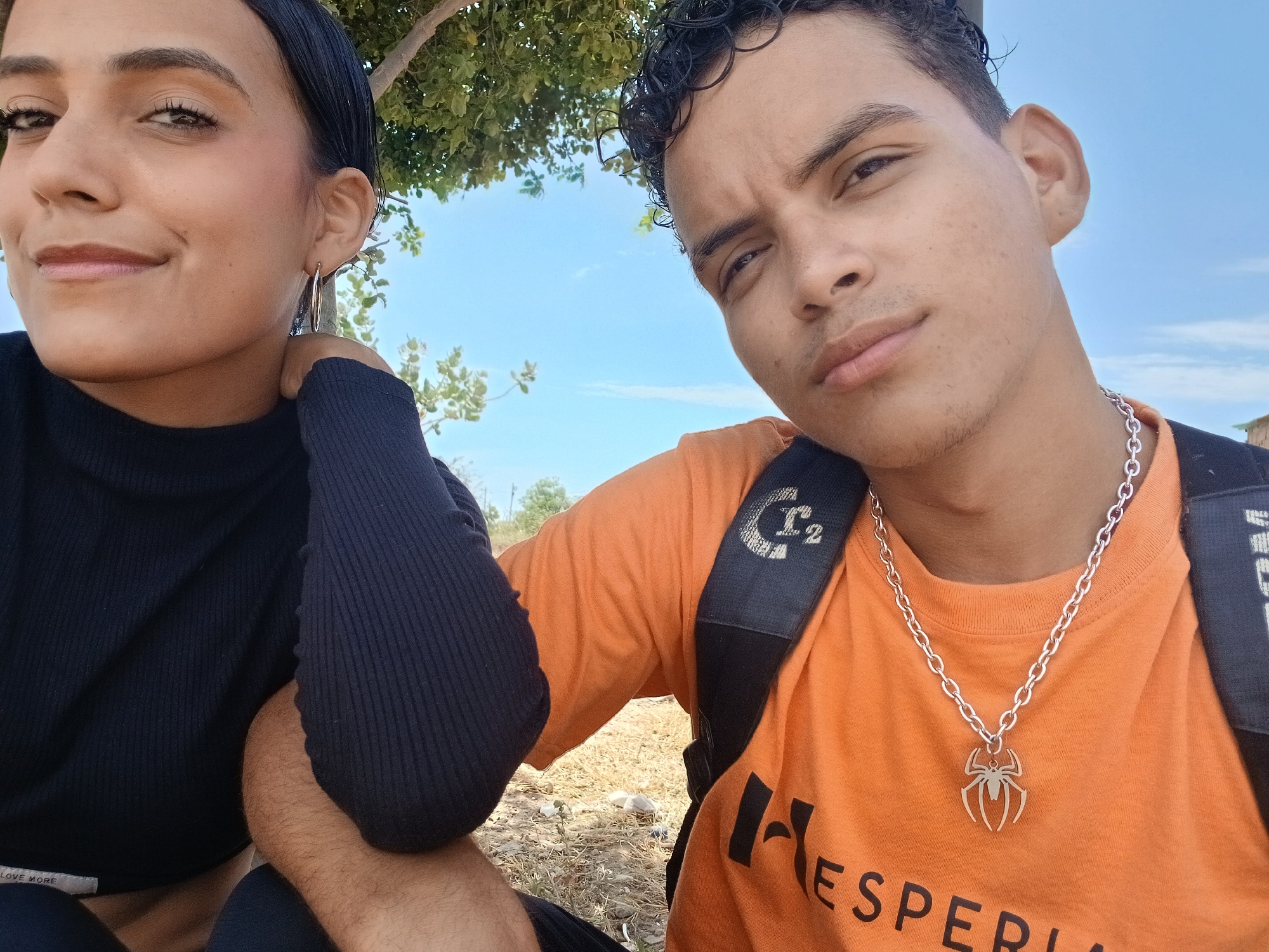 Young couple photographs outdoor portraits in sunny Altagracia, Venezuela