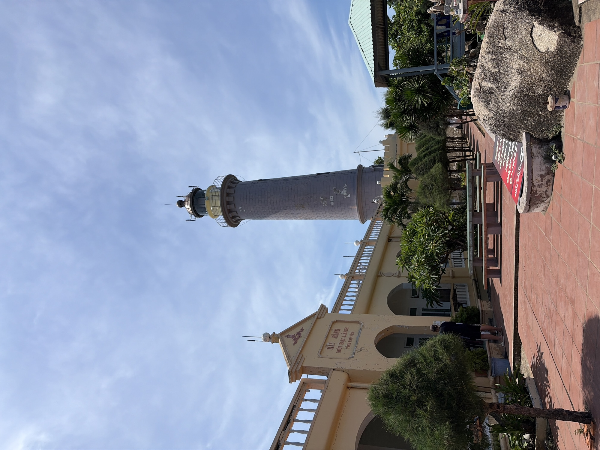 Coastal Vietnamese headland with lighthouse, beach views, and outdoor gym