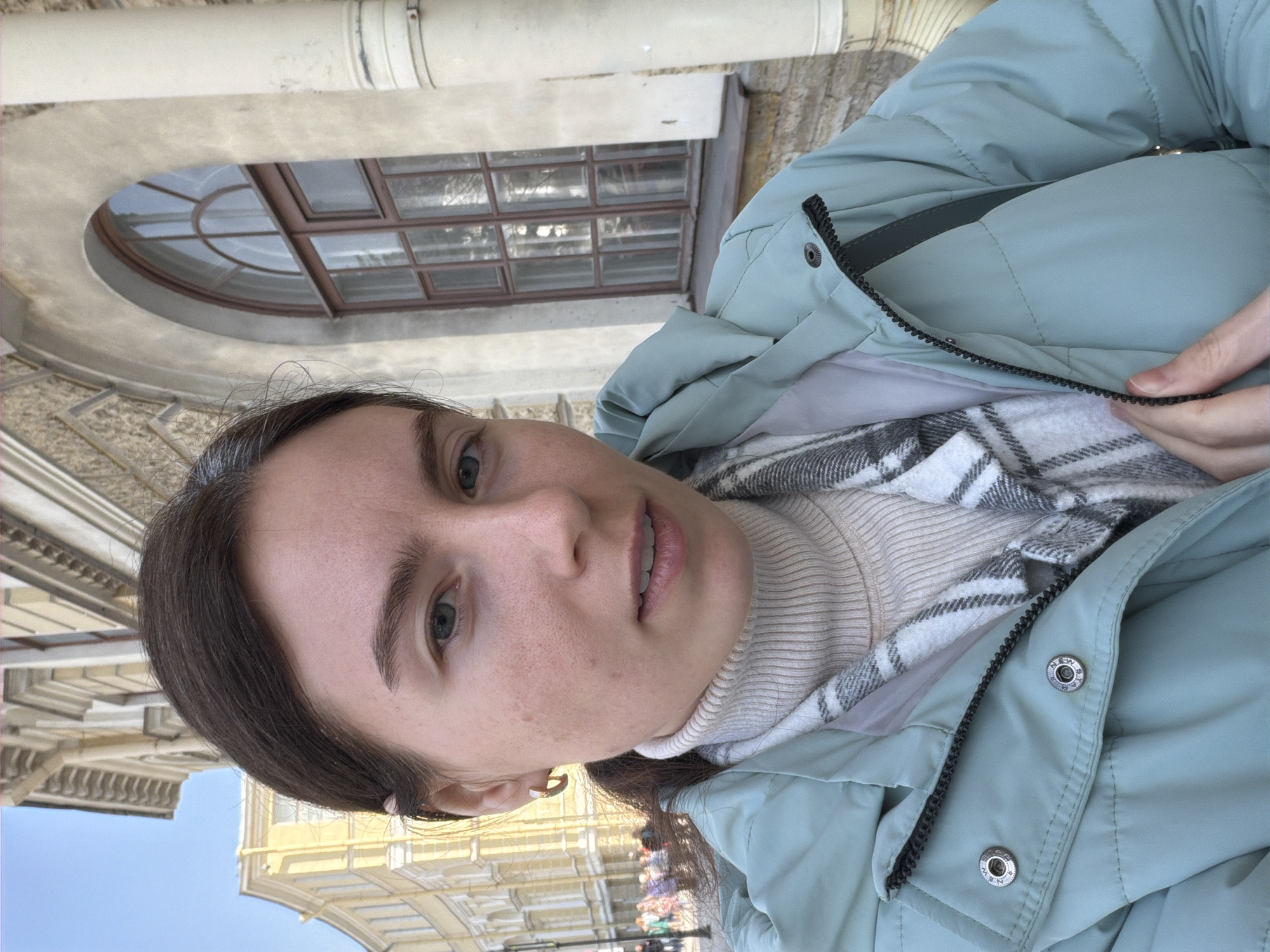 Tourist documents Saint Petersburg architecture and selfies during morning visit