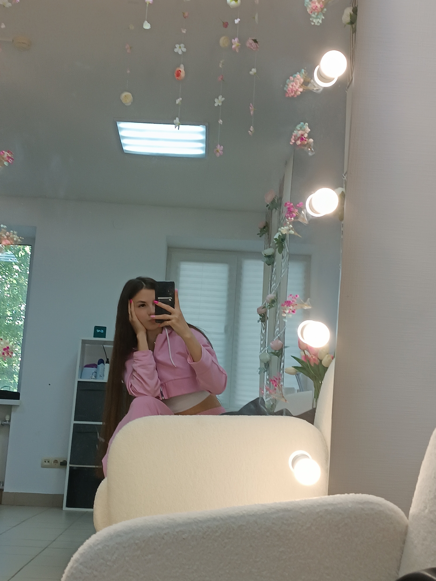 Woman documents morning routine with mirror selfies and coffee