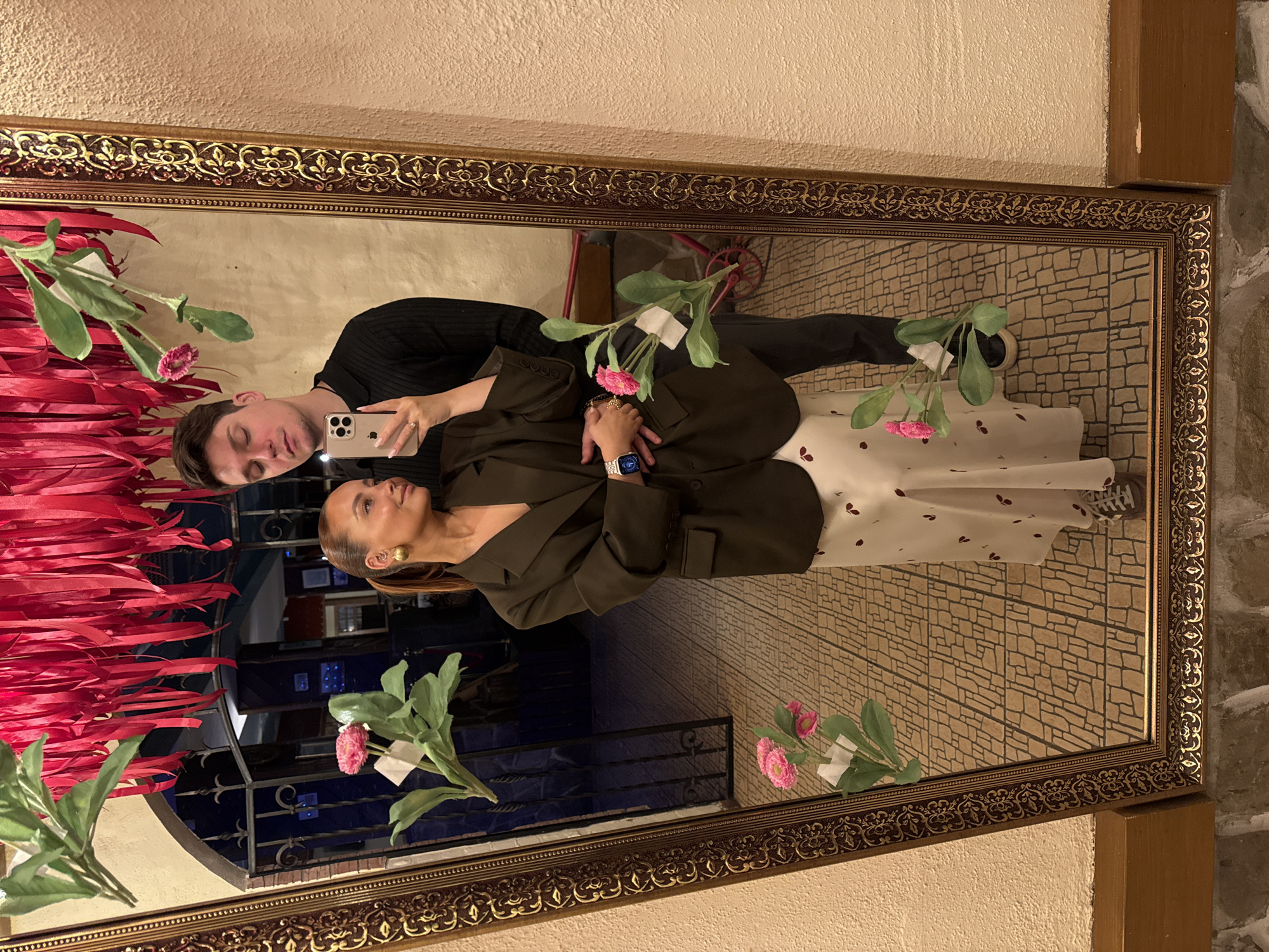 Couple takes selfie in ornate mirror in Chaikovsky