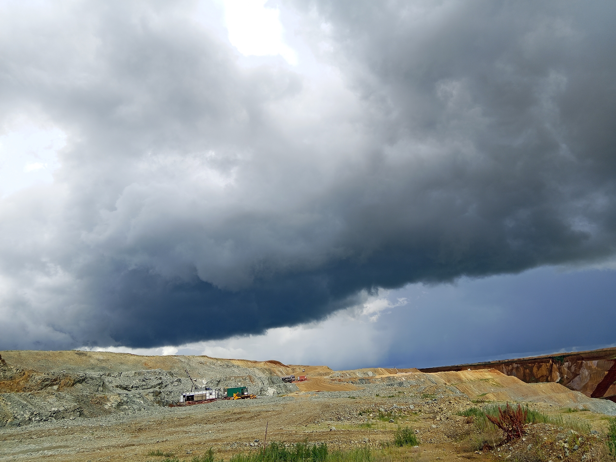 Stormy skies over a Kazakhstan quarry, ground level details