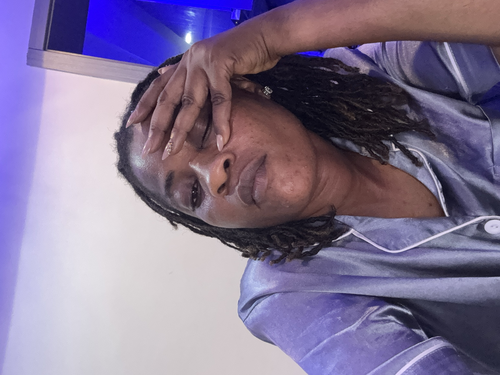 Late-evening selfie session in Ajara, Nigeria, in satin pajamas
