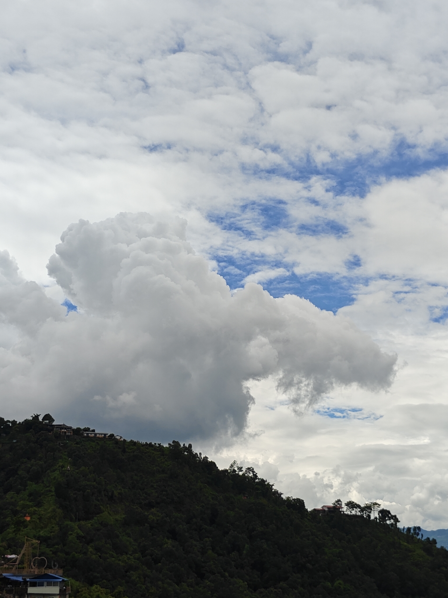 Morning at a Buddhist hilltop overlooking Pokhara's valley and mountains