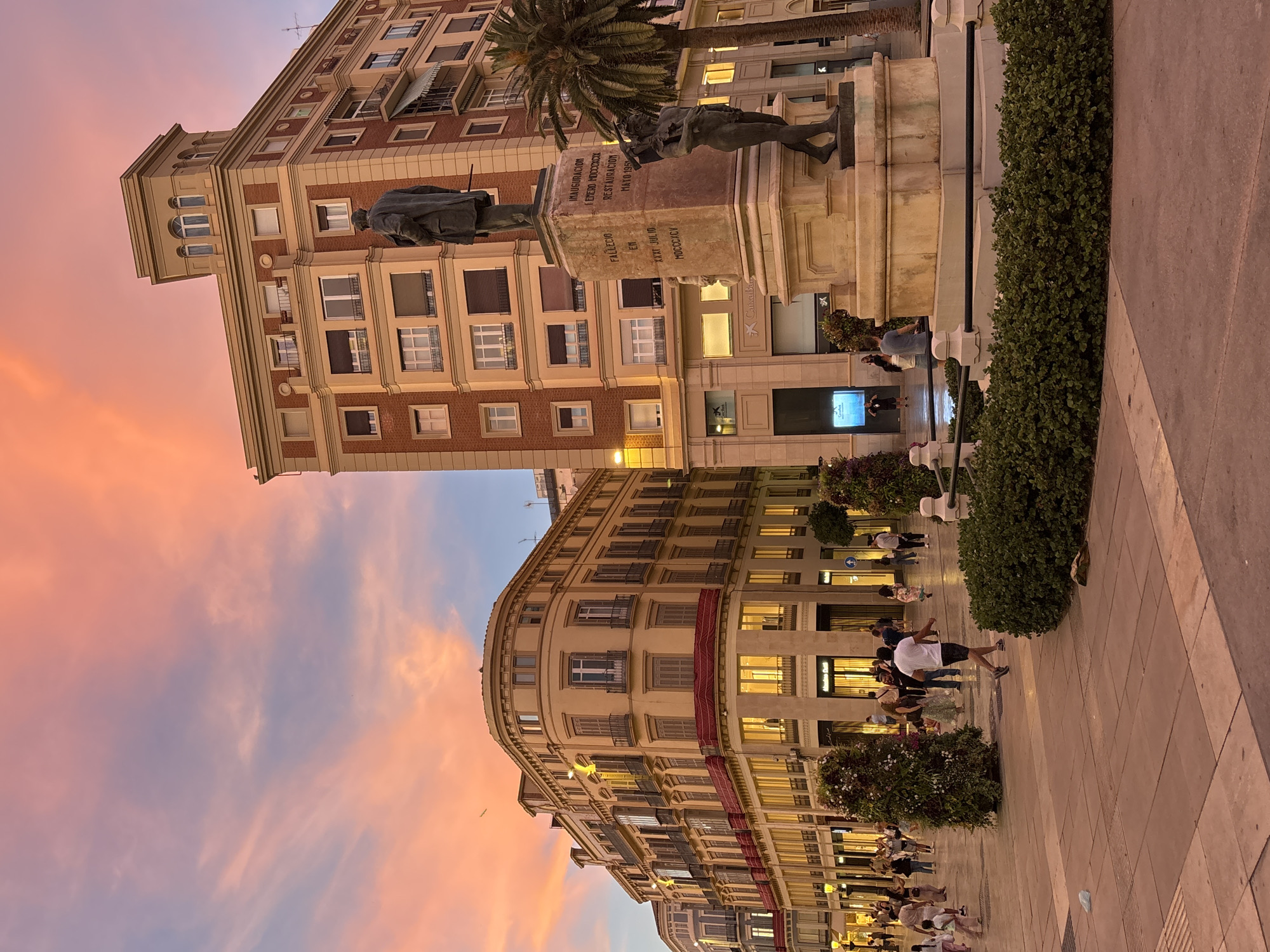 Dusk twilight scene captured in Málaga street plaza