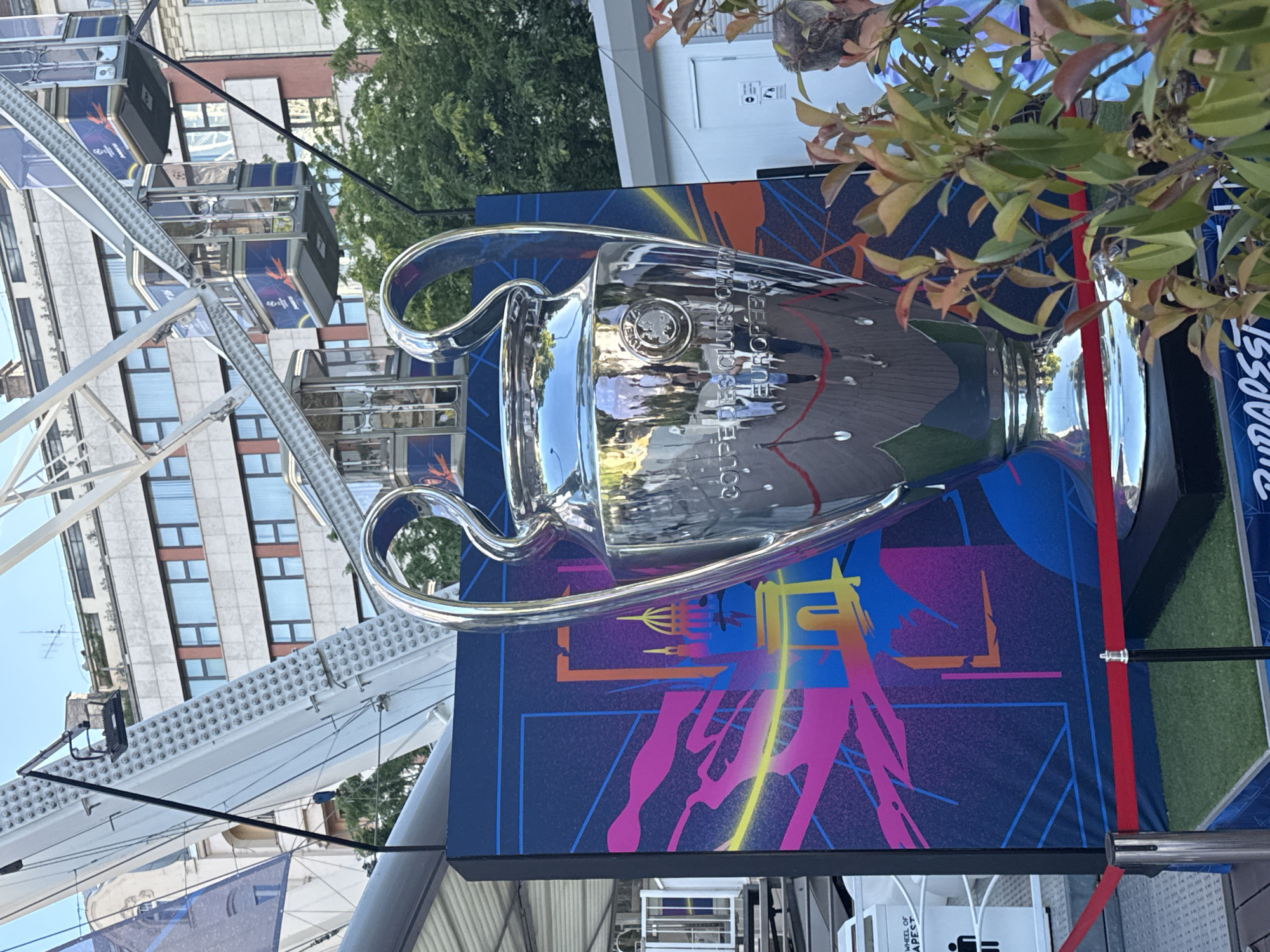 Champions League trophy display draws crowds near Budapest ferris wheel