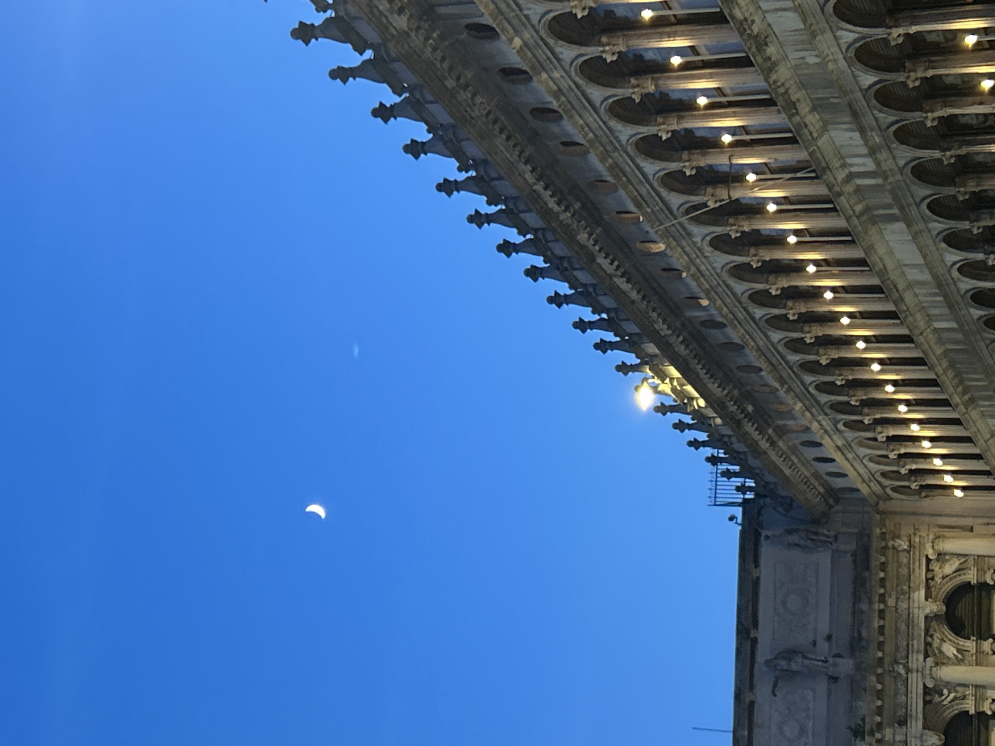 Venice's Bridge of Sighs and crescent moon at twilight