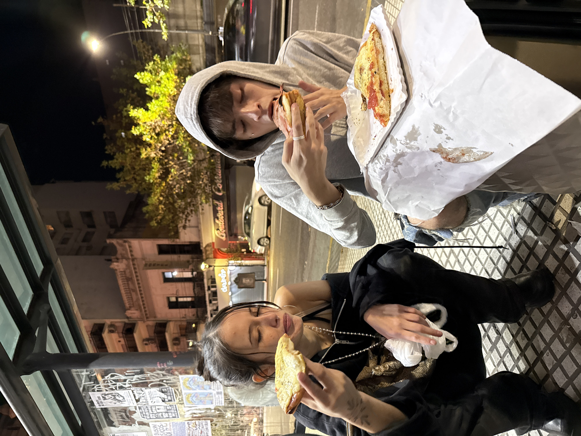 Late-night pizza meal observed on Buenos Aires street