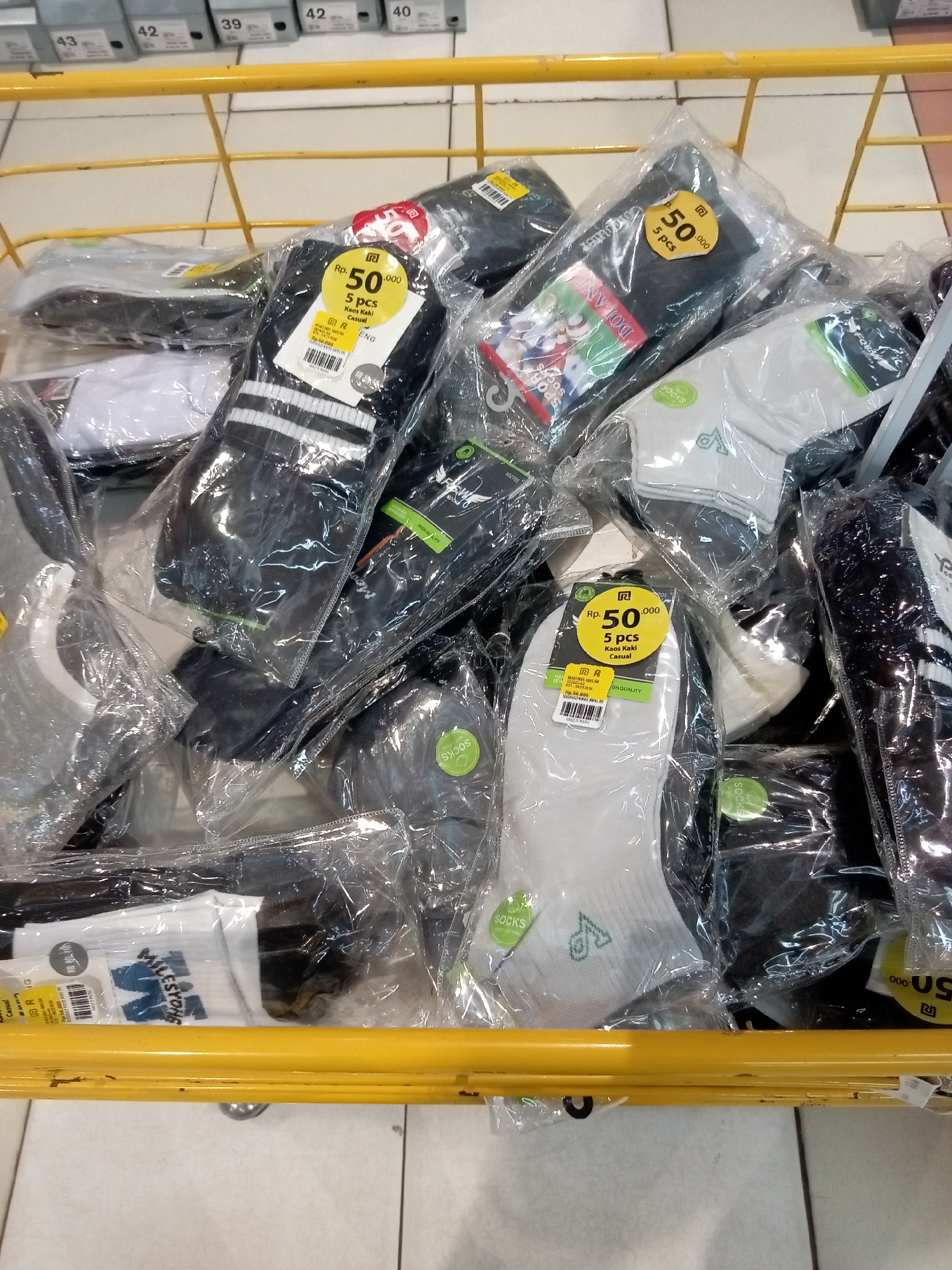 Browsing a Batam department store's shoes, clothing, and merchandise