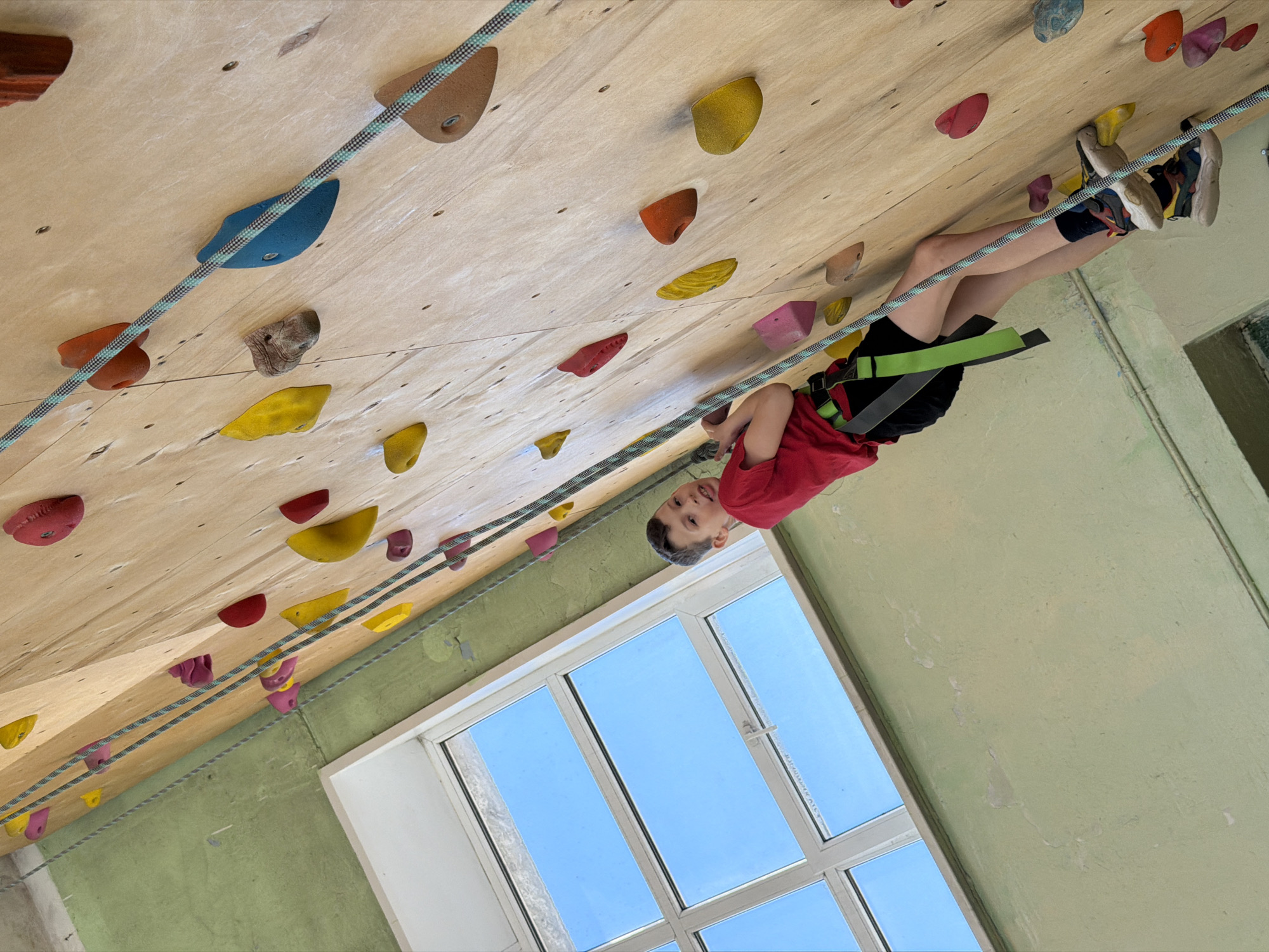Young climbers practice indoor rock climbing in Izhevsk facility