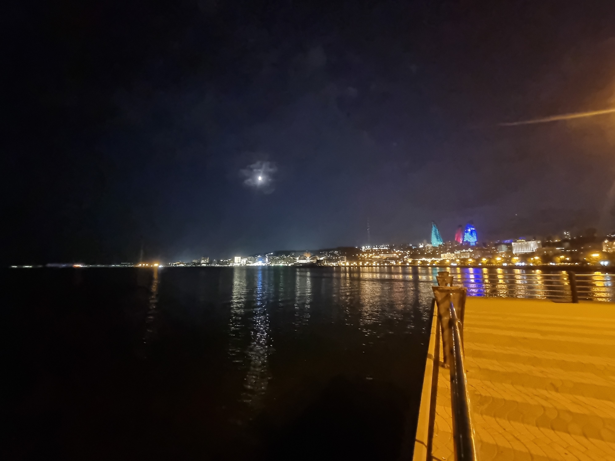 Baku's Flame Towers and waterfront promenade at night