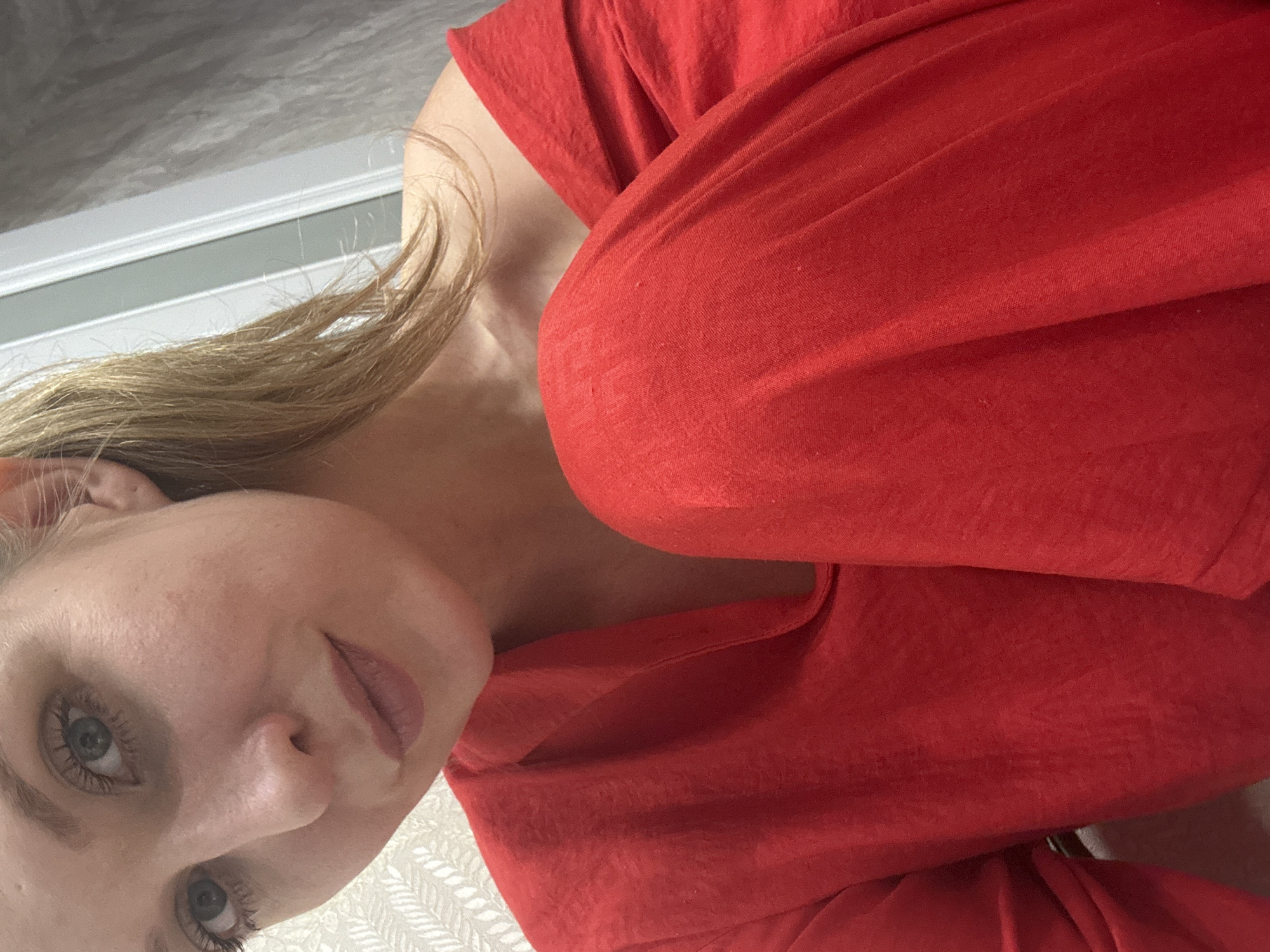 Woman in red pajamas conducts kitchen activities in Izhevsk home