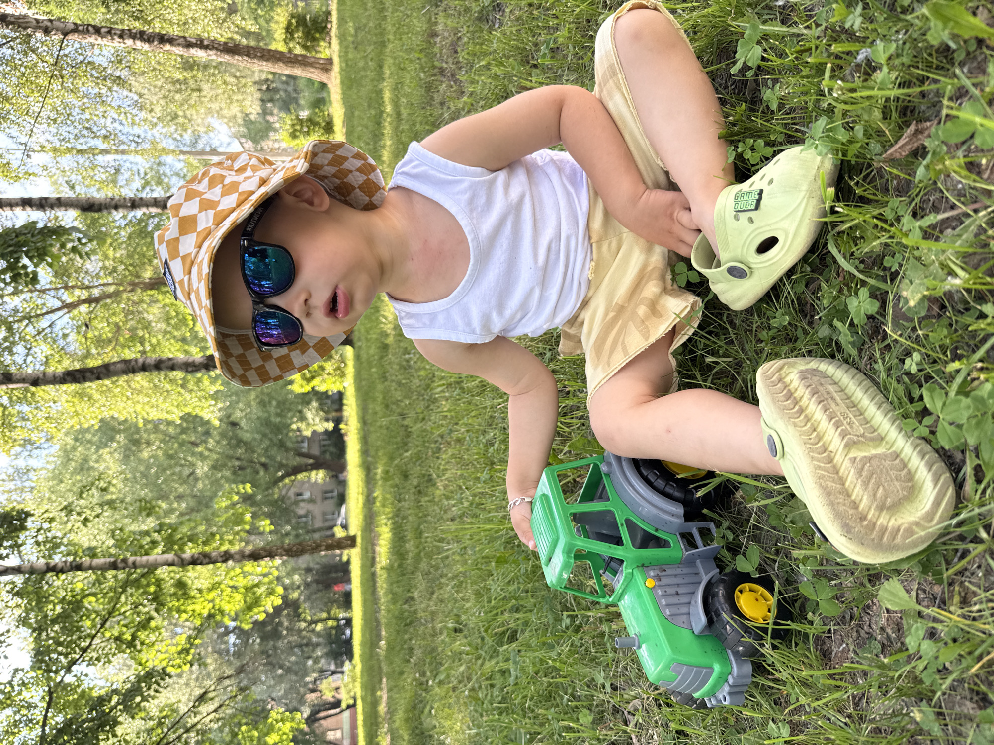 Family enjoys sunny afternoon at Rusanovo park with toys