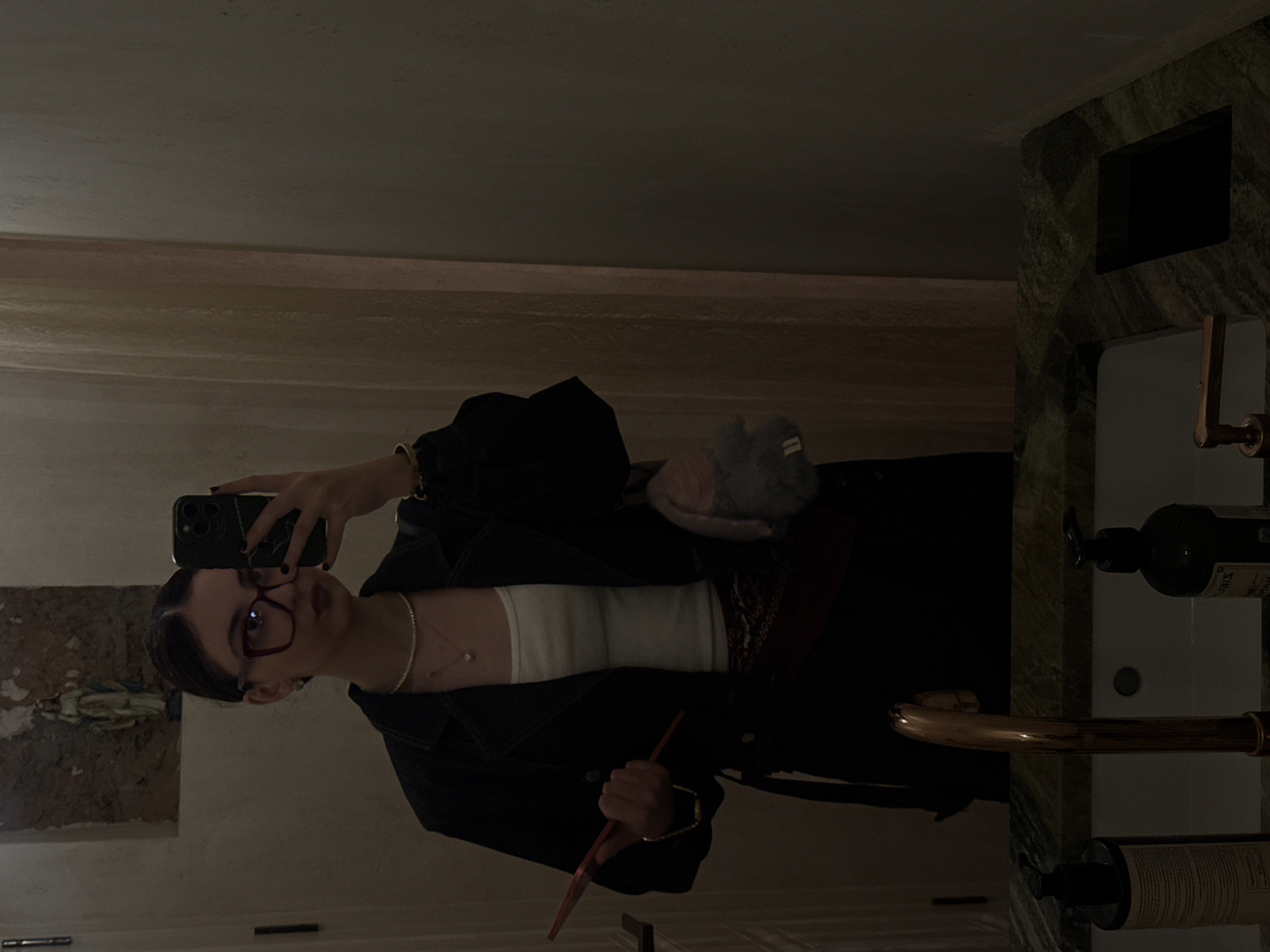 Woman takes selfies at Yerevan restaurant during evening visit