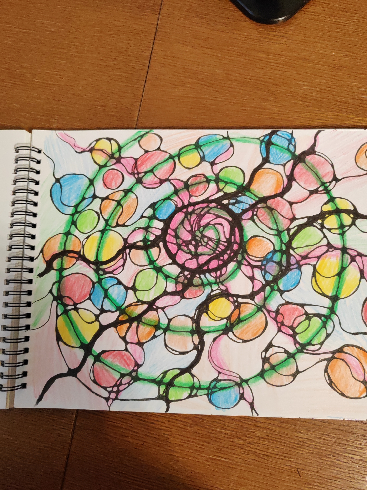 Artist documents jewelry supplies and abstract sketches in Brest
